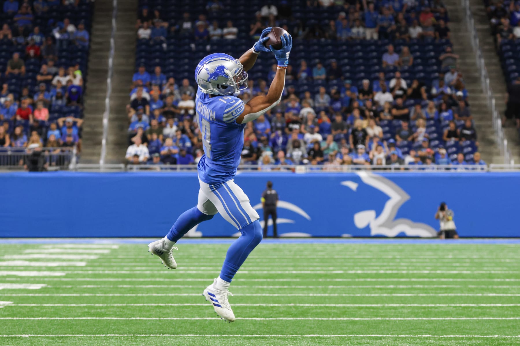 DETROIT, MI - AUGUST 12:  Detroit Lions  wide receiver Amon-Ra St. Brown (14) catches a pass during a preseason NFL football game between the Atlanta Falcons and Detroit Lions on August 12, 2022 at Ford Field in Detroit, Michigan.(Photo by Scott W. Grau/Icon Sportswire via Getty Images)