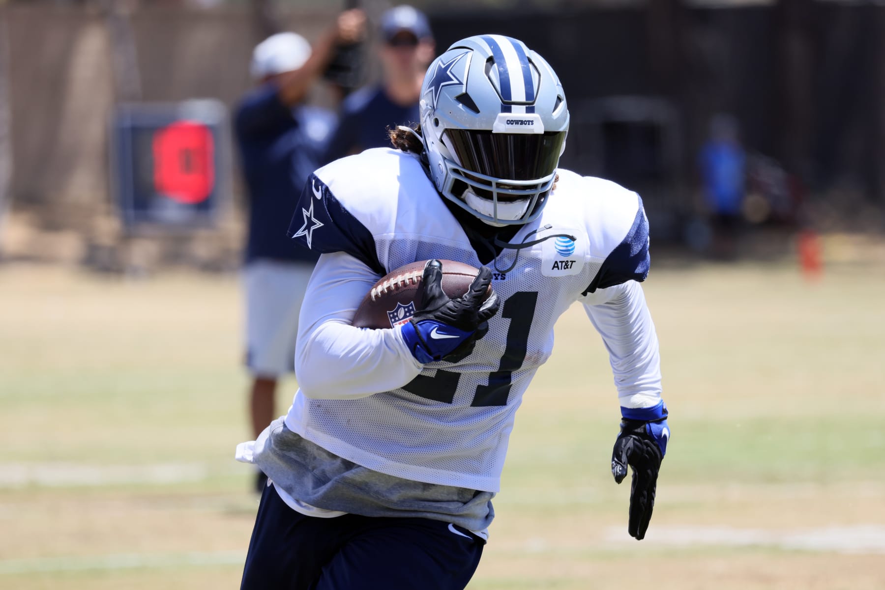 OXNARD, CALIFORNIA - AUGUST 09: Running back Ezekiel Elliott #21 carries the ball during the Dallas Cowboys training camp at River Ridge Fields on August 09, 2022 in Oxnard, California. (Photo by Josh Lefkowitz/Getty Images)