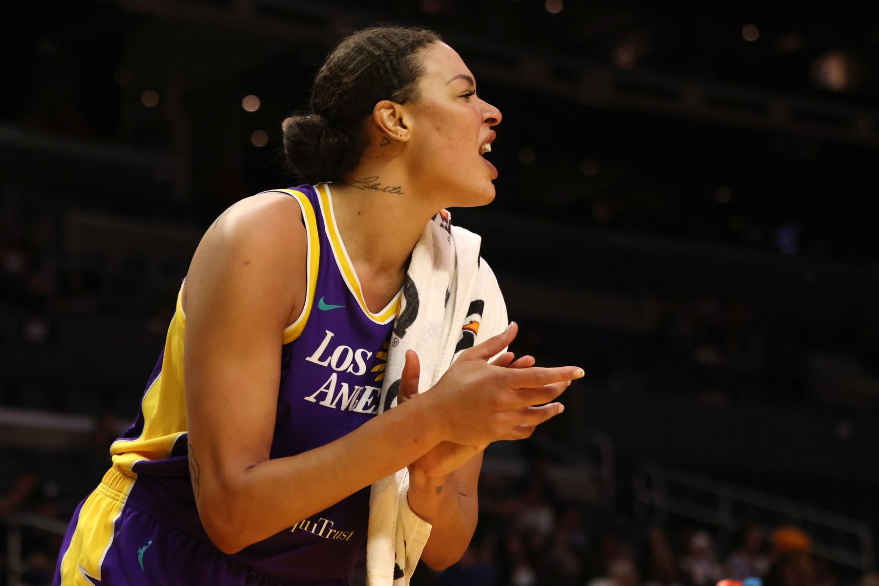 LOS ANGELES, CALIFORNIA - JULY 12: Liz Cambage #1 of the Los Angeles Sparks cheers from the bench during a game against the Washington Mystics at Crypto.com Arena on July 12, 2022 in Los Angeles, California. NOTE TO USER: User expressly acknowledges and agrees that, by downloading and or using this photograph, User is consenting to the terms and conditions of the Getty Images License Agreement. (Photo by Katharine Lotze/Getty Images)