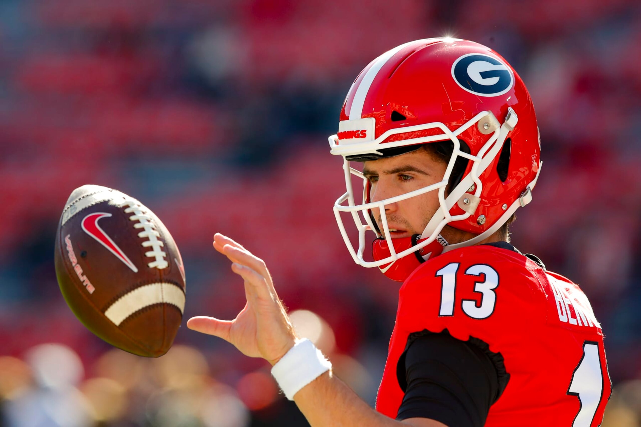 ATHENS, GA - NOVEMBER 20: Stetson Bennett #13 of the Georgia Bulldogs warms up prior to the game against the Charleston Southern Buccaneers at Sanford Stadium on November 20, 2021 in Athens, Georgia. (Photo by Todd Kirkland/Getty Images)