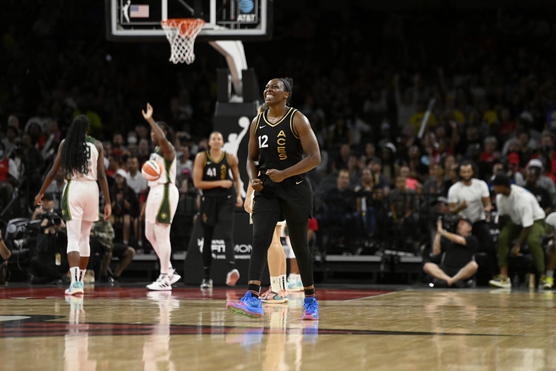 LAS VEGAS, NV - AUGUST 14: Chelsea Gray #12 of the Las Vegas Aces celebrates during the game against the Seattle Storm on August 14, 2022 at  Michelob ULTRA Arena in Las Vegas, Nevada. NOTE TO USER: User expressly acknowledges and agrees that, by downloading and or using this photograph, User is consenting to the terms and conditions of the Getty Images License Agreement. Mandatory Copyright Notice: Copyright 2022 NBAE (Photo by David Becker/NBAE via Getty Images)
