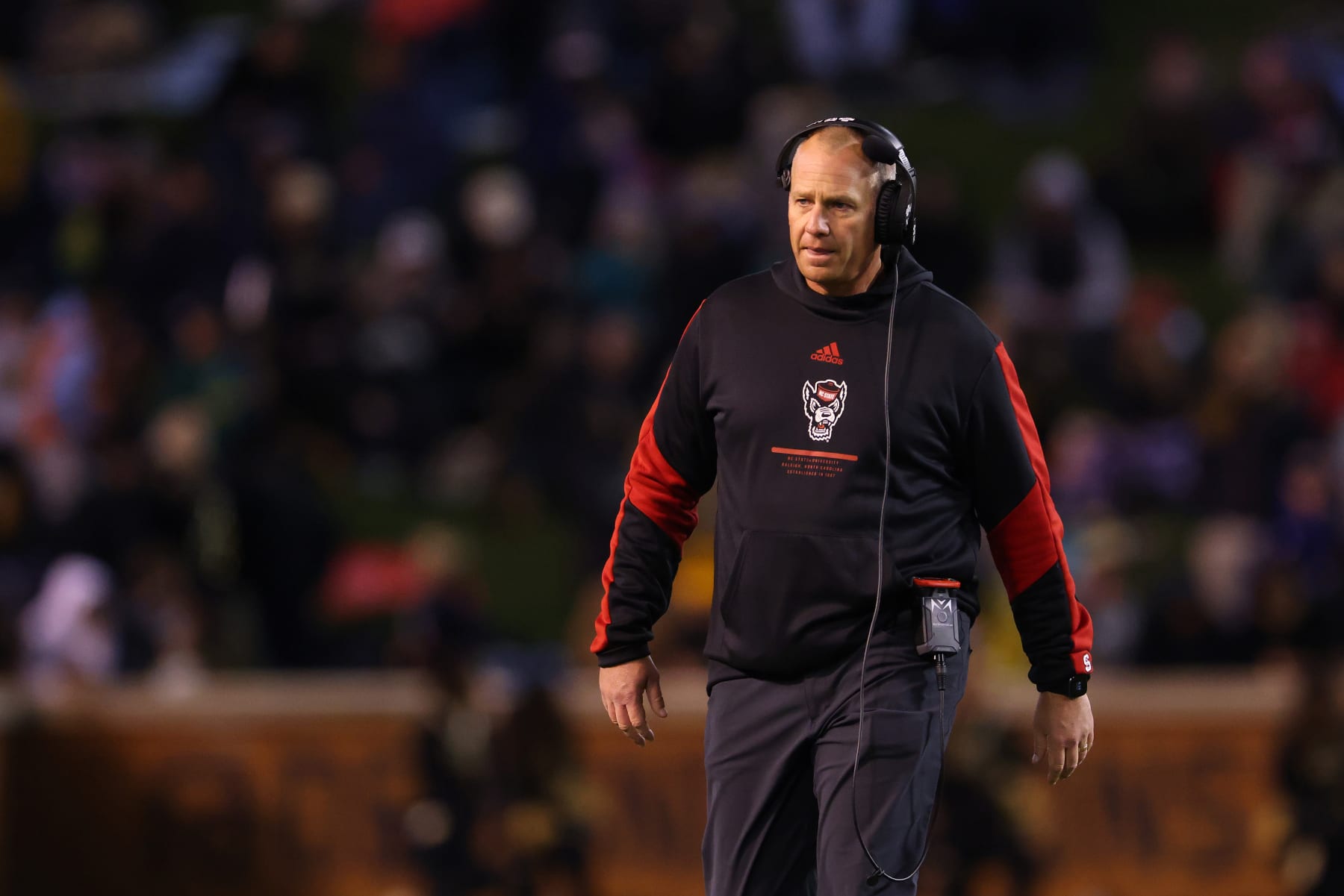 WINSTON-SALEM, NORTH CAROLINA - NOVEMBER 13: Head coach Dave Doeren of the North Carolina State Wolfpack  watches his team play against the Wake Forest Demon Deacons during their game at Truist Field on November 13, 2021 in Winston-Salem, North Carolina. Wake Forest won 45-42. (Photo by Grant Halverson/Getty Images)