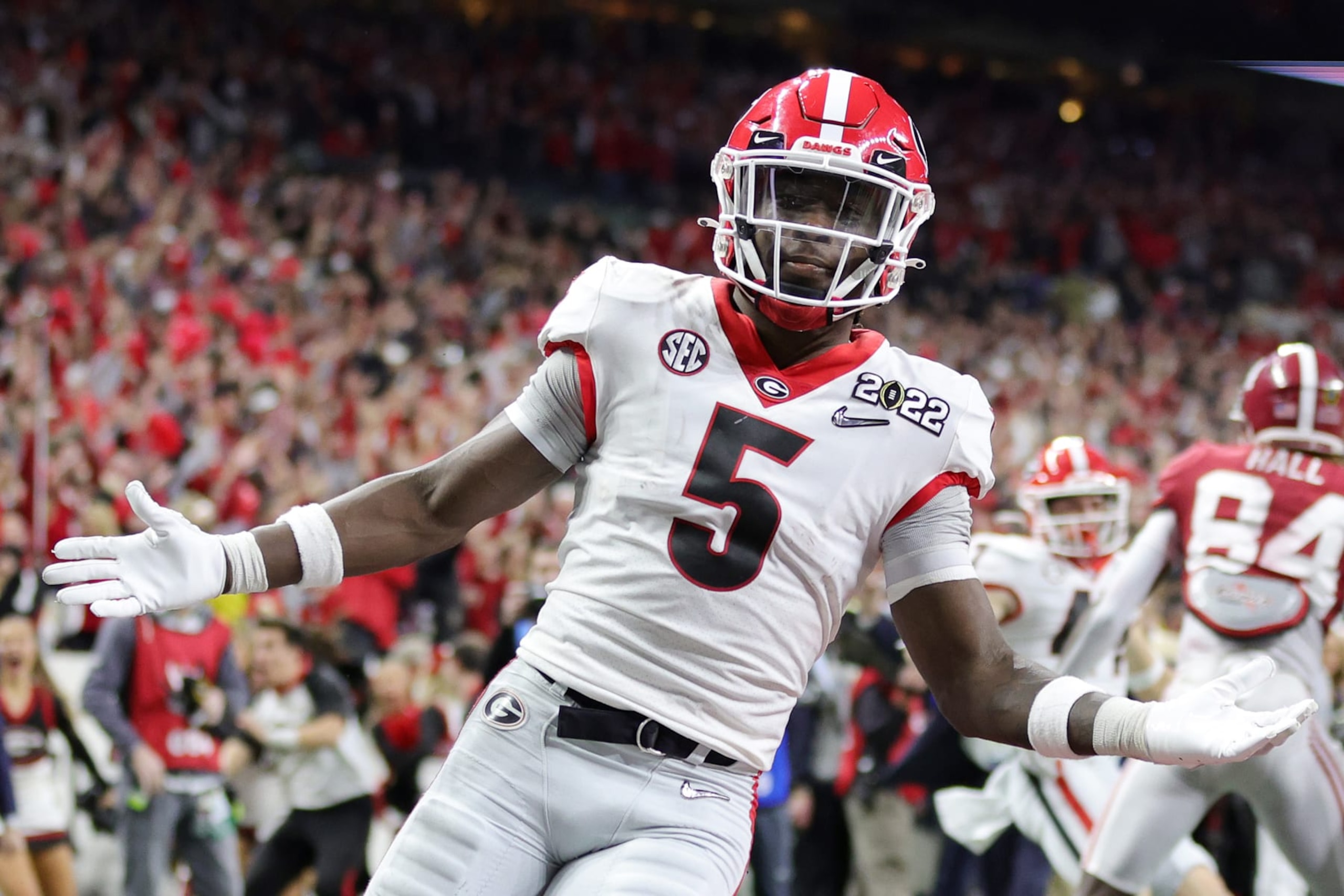 INDIANAPOLIS, INDIANA - JANUARY 10: Kelee Ringo #5 of the Georgia Bulldogs celebrates after getting an interception and scoring a touchdown in the fourth quarter of the game against the Alabama Crimson Tide during the 2022 CFP National Championship Game at Lucas Oil Stadium on January 10, 2022 in Indianapolis, Indiana. (Photo by Carmen Mandato/Getty Images)