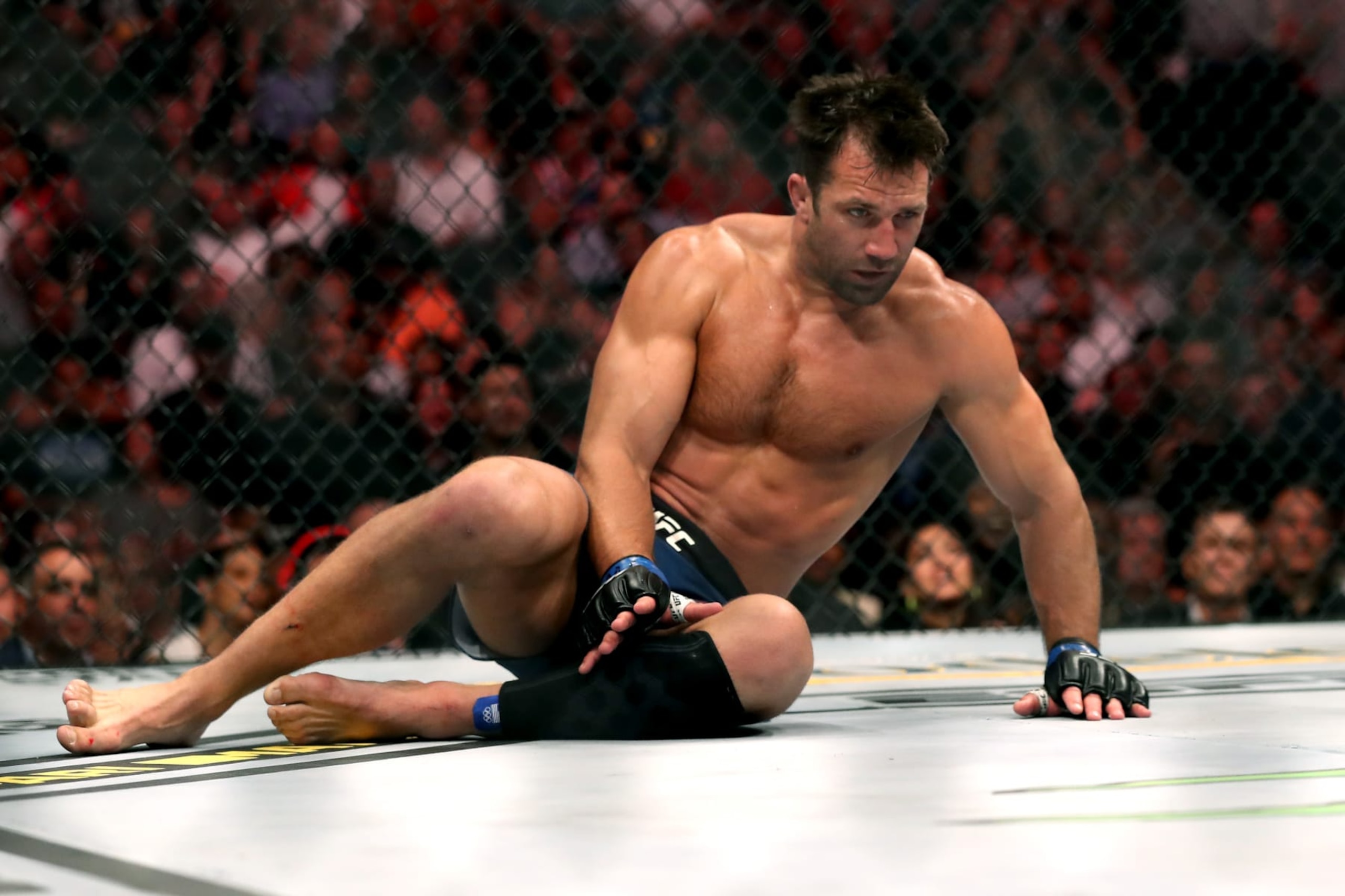 LAS VEGAS, NEVADA - JULY 06: Luke Rockhold of the United States looks on after being knocked out by Jan Blachowicz of Poland during their UFC 239 Light Heavyweight bout at T-Mobile Arena on July 06, 2019 in Las Vegas, Nevada. (Photo by Sean M. Haffey/Getty Images) LAS VEGAS, NEVADA - JULY 06: Luke Rockhold of the United States looks on after being knocked out by Jan Blachowicz of Poland during their UFC 239 Light Heavyweight bout at T-Mobile Arena on July 06, 2019 in Las Vegas, Nevada. (Photo by Sean M. Haffey/Getty Images)