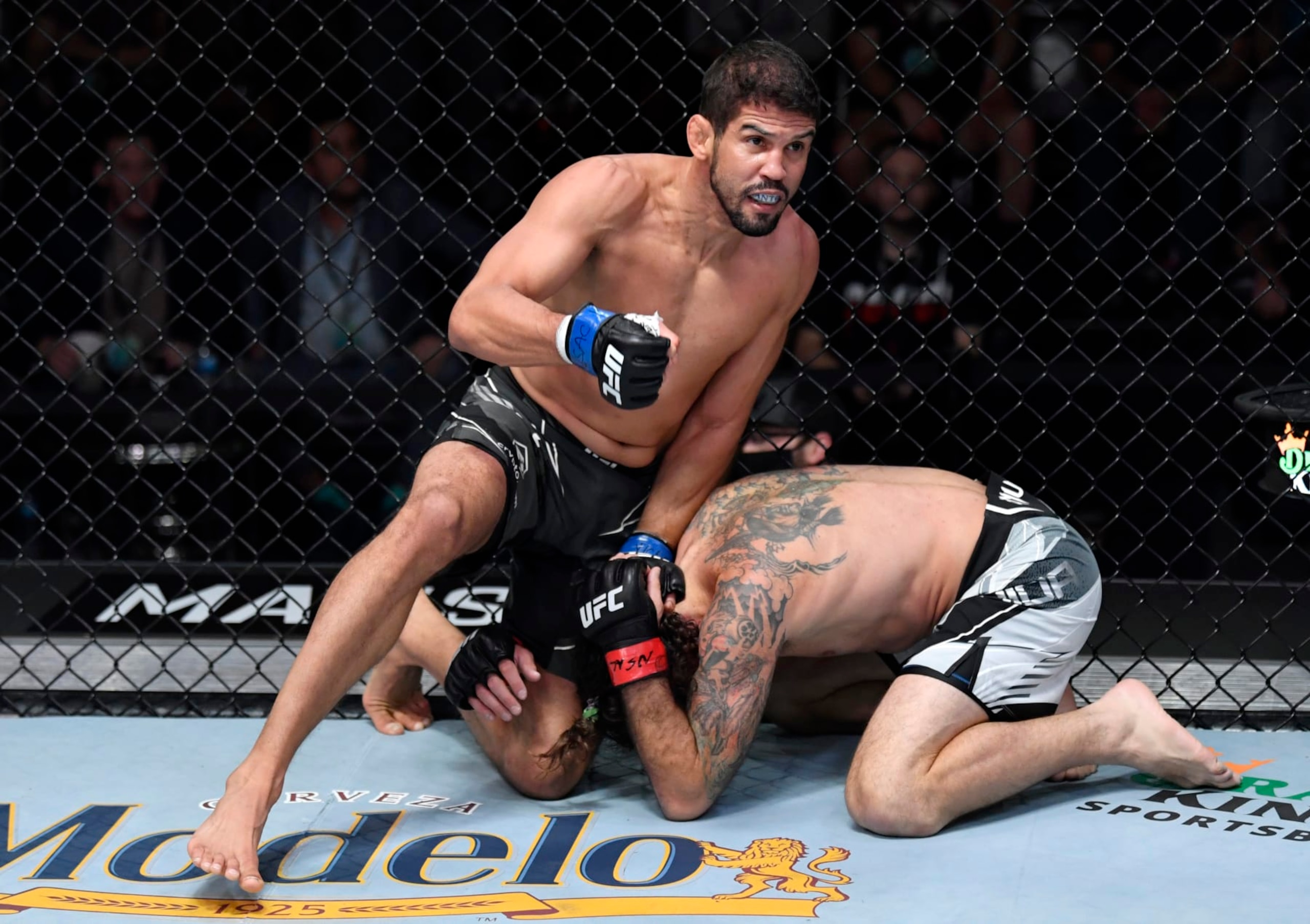 LAS VEGAS, NEVADA - DECEMBER 04: (L-R) Leonardo Santos of Brazil punches Clay Guida in their lightweight fight during the UFC Fight Night event at UFC APEX on December 04, 2021 in Las Vegas, Nevada. (Photo by Jeff Bottari/Zuffa LLC) LAS VEGAS, NEVADA - DECEMBER 04: (L-R) Leonardo Santos of Brazil punches Clay Guida in their lightweight fight during the UFC Fight Night event at UFC APEX on December 04, 2021 in Las Vegas, Nevada. (Photo by Jeff Bottari/Zuffa LLC)