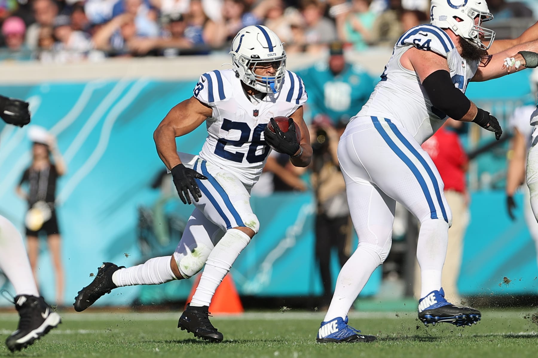 JACKSONVILLE, FL - JANUARY 09: Indianapolis Colts running back Jonathan Taylor (28) rushes for positive yardage during the game between the Indianapolis Colts and the Jacksonville Jaguars on January 9, 2022 at TIAA Bank Field in Jacksonville, FL (Photo by Icon Sportswire)