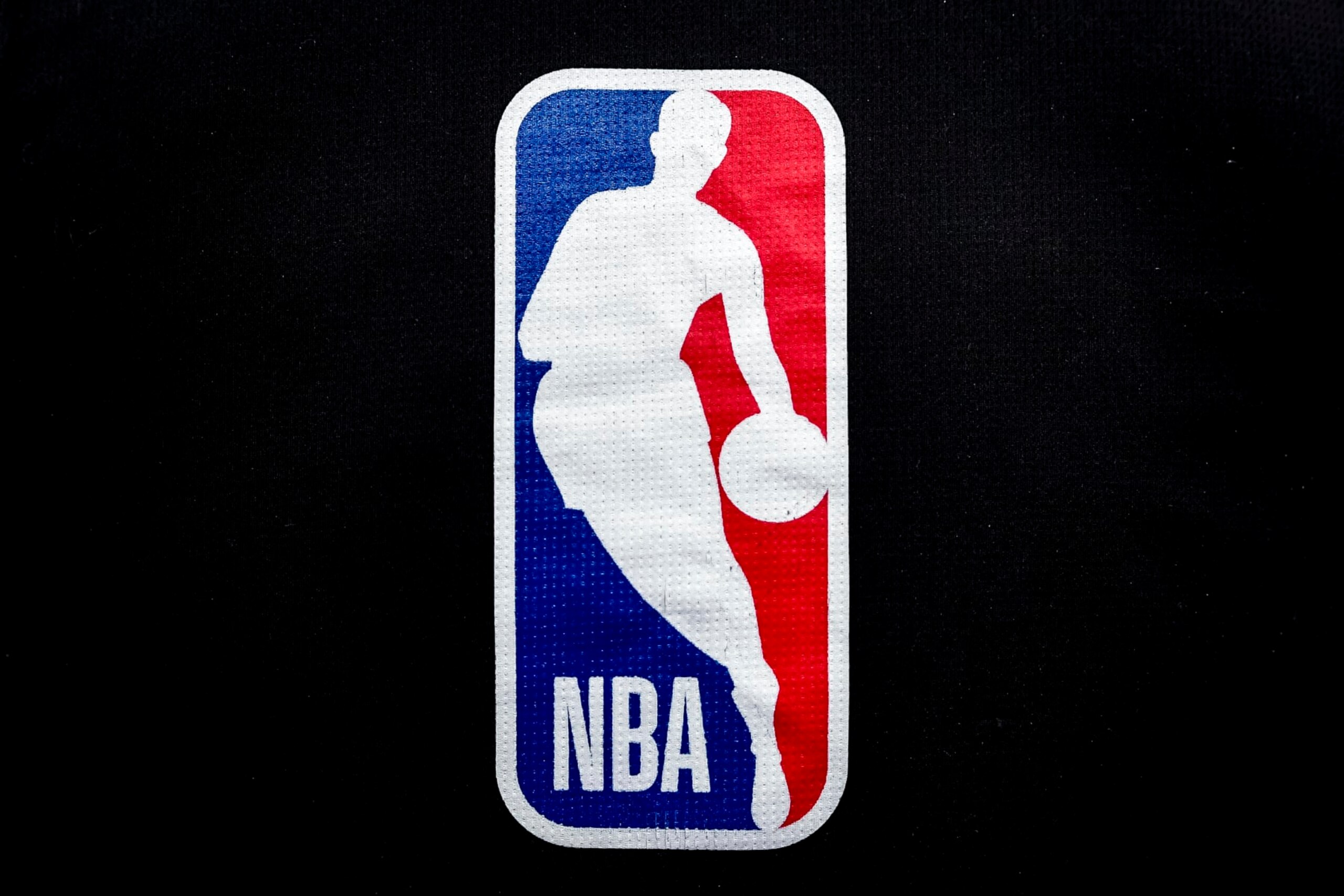 DETROIT, MICHIGAN - JANUARY 08: The NBA logo is pictured ahead of the game between the Detroit Pistons and Orlando Magic at Little Caesars Arena on January 08, 2022 in Detroit, Michigan. NOTE TO USER: User expressly acknowledges and agrees that, by downloading and or using this photograph, User is consenting to the terms and conditions of the Getty Images License Agreement. (Photo by Nic Antaya/Getty Images) DETROIT, MICHIGAN - JANUARY 08: The NBA logo is pictured ahead of the game between the Detroit Pistons and Orlando Magic at Little Caesars Arena on January 08, 2022 in Detroit, Michigan. NOTE TO USER: User expressly acknowledges and agrees that, by downloading and or using this photograph, User is consenting to the terms and conditions of the Getty Images License Agreement. (Photo by Nic Antaya/Getty Images)