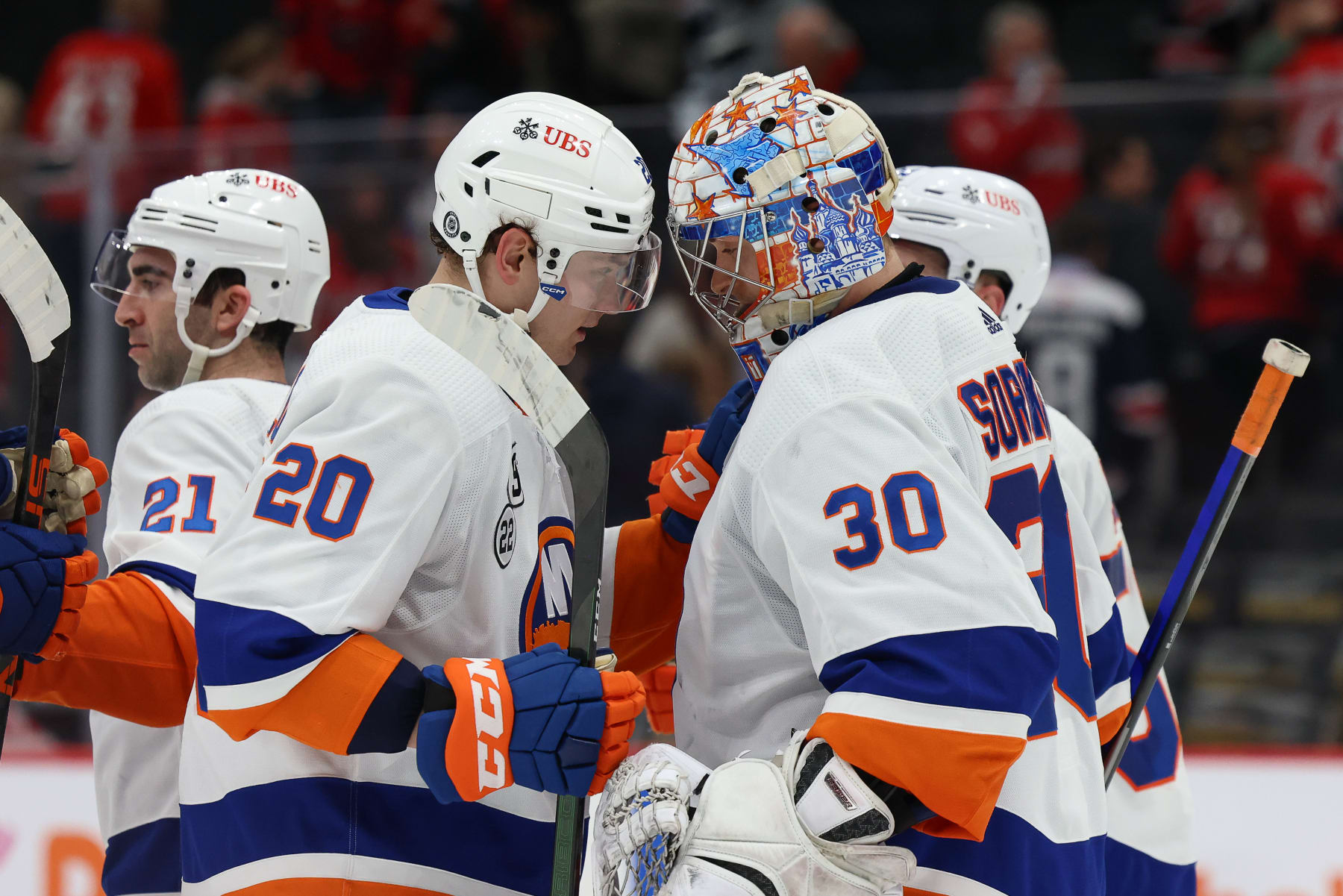 WASHINGTON, DC - APRIL 26: Kieffer Bellows #20 and Ilya Sorokin #30 of the New York Islanders celebrate a win against the Washington Capitals at Capital One Arena on April 26, 2022 in Washington, D.C. (Photo by John McCreary/NHLI via Getty Images) WASHINGTON, DC - APRIL 26: Kieffer Bellows #20 and Ilya Sorokin #30 of the New York Islanders celebrate a win against the Washington Capitals at Capital One Arena on April 26, 2022 in Washington, D.C. (Photo by John McCreary/NHLI via Getty Images)