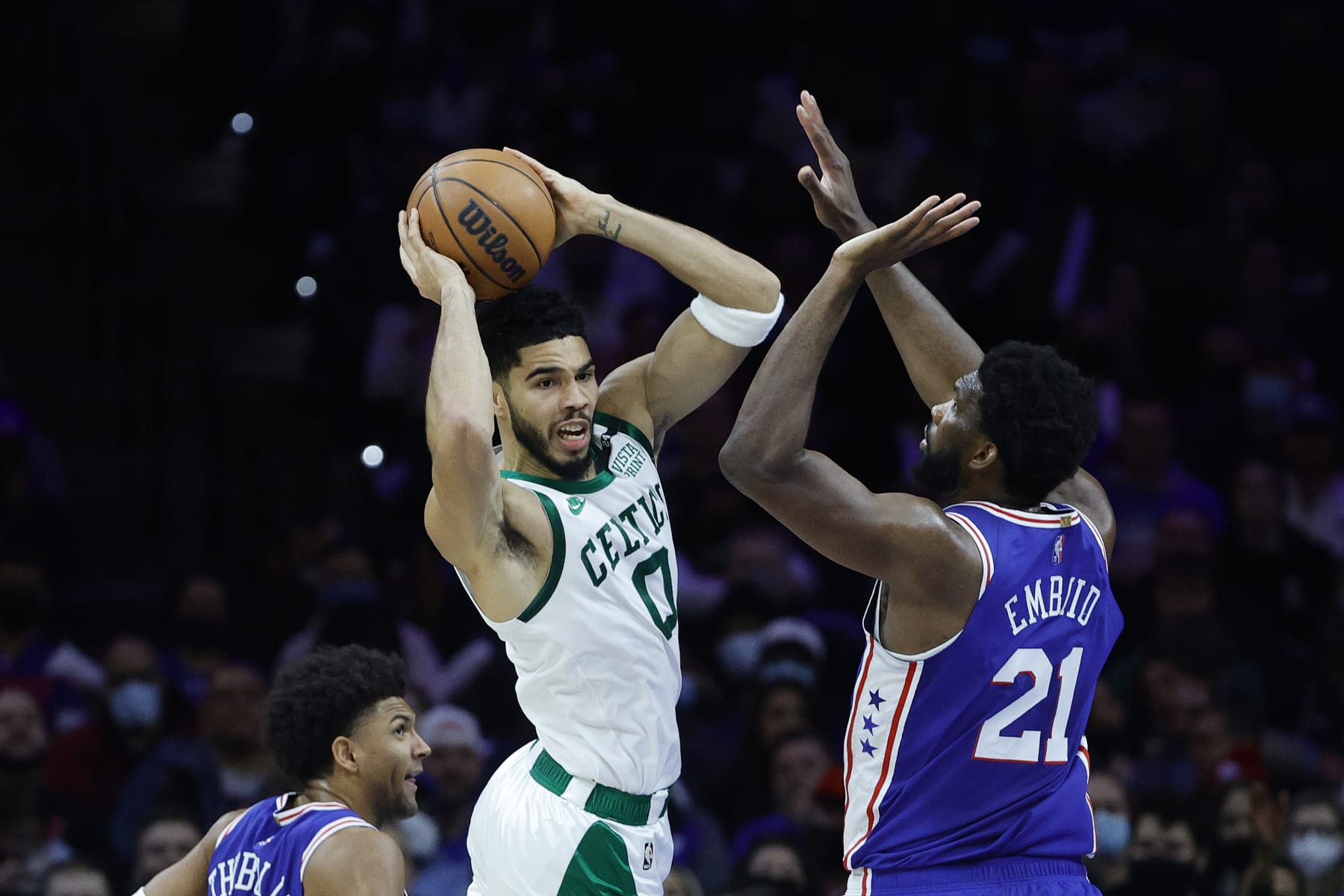 PHILADELPHIA, PENNSYLVANIA - JANUARY 14: Jayson Tatum #0 of the Boston Celtics attempts a pass past Joel Embiid #21 of the Philadelphia 76ers during the third quarter at Wells Fargo Center on January 14, 2022 in Philadelphia, Pennsylvania. NOTE TO USER: User expressly acknowledges and agrees that, by downloading and or using this photograph, User is consenting to the terms and conditions of the Getty Images License Agreement. (Photo by Tim Nwachukwu/Getty Images) PHILADELPHIA, PENNSYLVANIA - JANUARY 14: Jayson Tatum #0 of the Boston Celtics attempts a pass past Joel Embiid #21 of the Philadelphia 76ers during the third quarter at Wells Fargo Center on January 14, 2022 in Philadelphia, Pennsylvania. NOTE TO USER: User expressly acknowledges and agrees that, by downloading and or using this photograph, User is consenting to the terms and conditions of the Getty Images License Agreement. (Photo by Tim Nwachukwu/Getty Images)