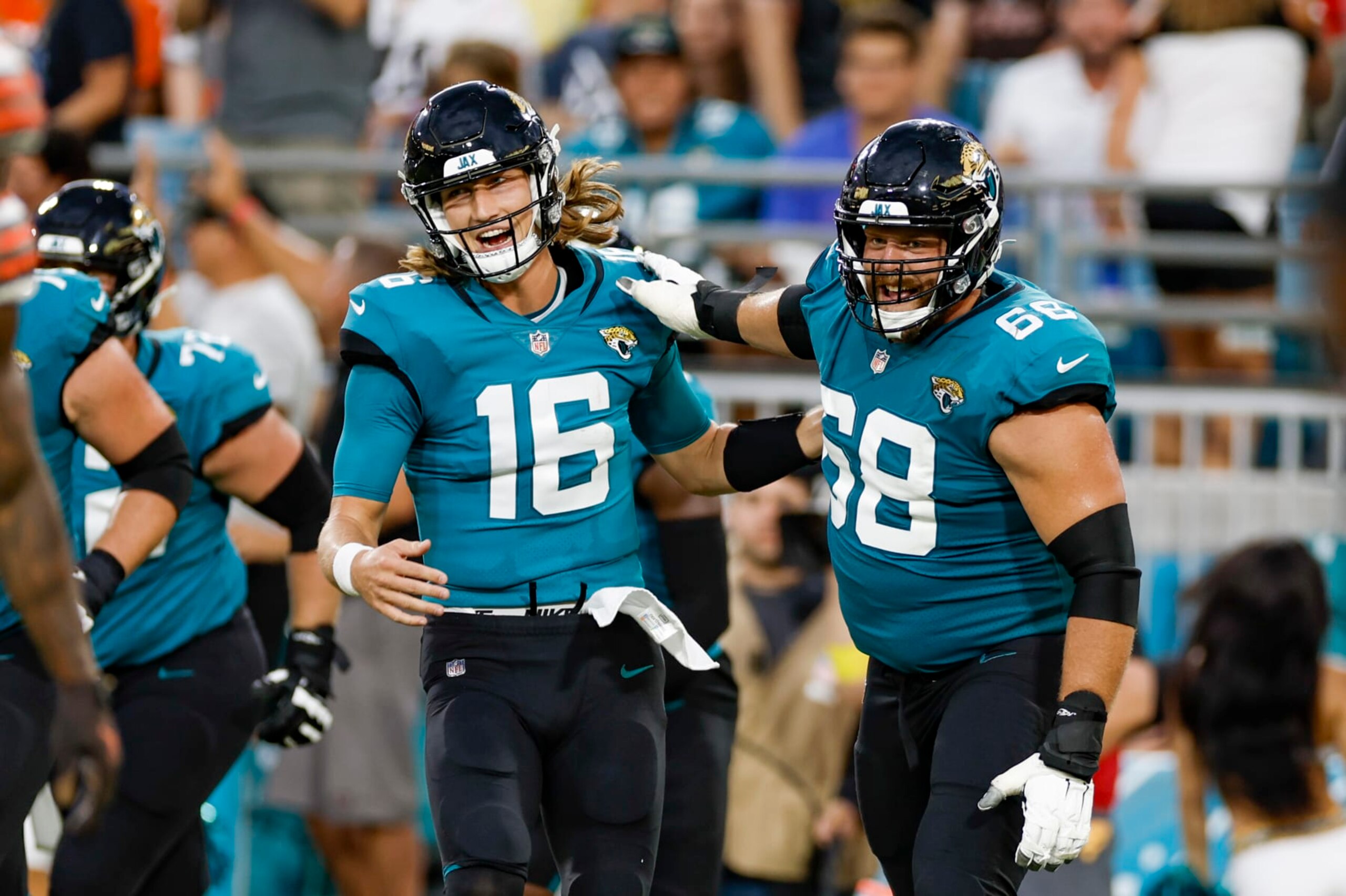 JACKSONVILLE, FL - AUGUST 12: Jacksonville Jaguars quarterback Trevor Lawrence (16) and Jacksonville Jaguars guard Brandon Scherff (68) celebrate a touchdown pass during the game between the Cleveland Browns and the Jacksonville Jaguars on August 12, 2022 at TIAA Bank Field in Jacksonville, Fl. (Photo by David Rosenblum/Icon Sportswire via Getty Images)