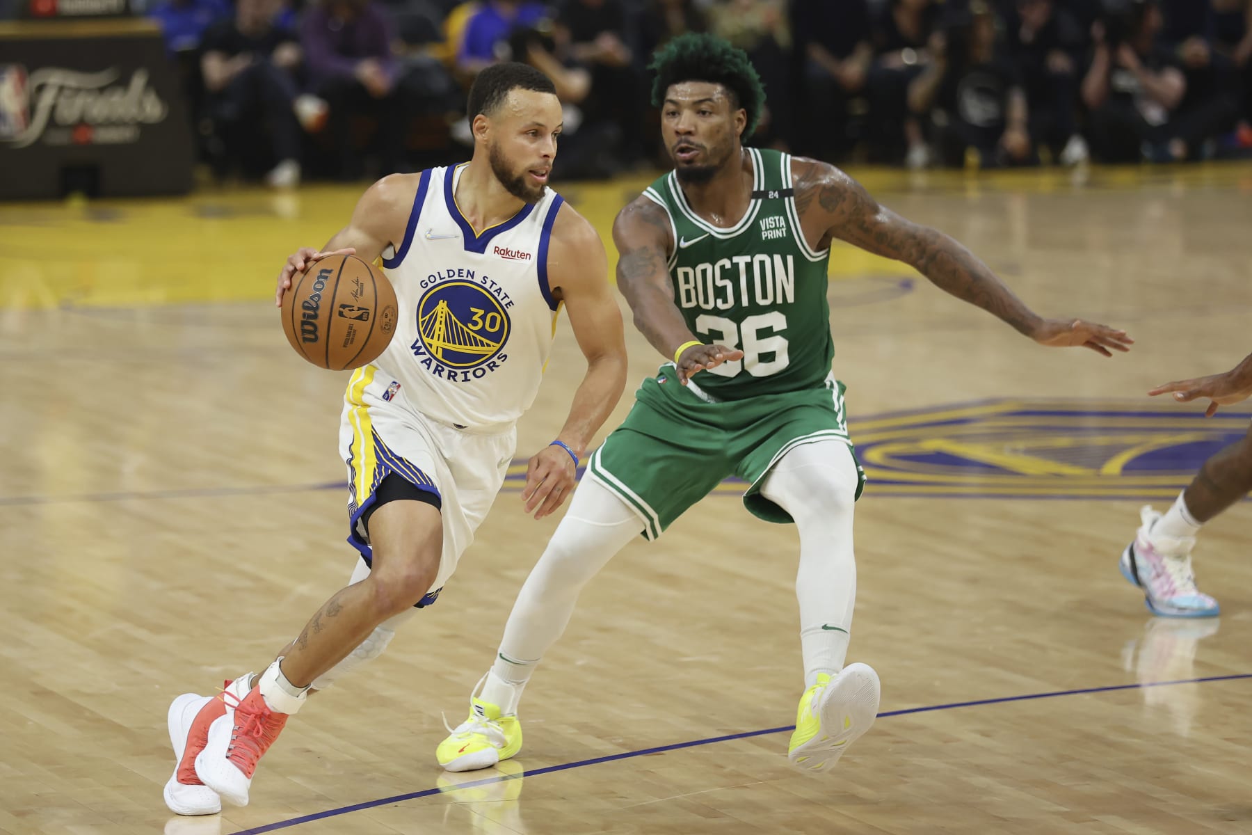 Golden State Warriors guard Stephen Curry (30) drives to the basket against Boston Celtics guard Marcus Smart (36) during Game 2 of basketball's NBA Finals in San Francisco, Sunday, June 5, 2022. (AP Photo/Jed Jacobsohn)