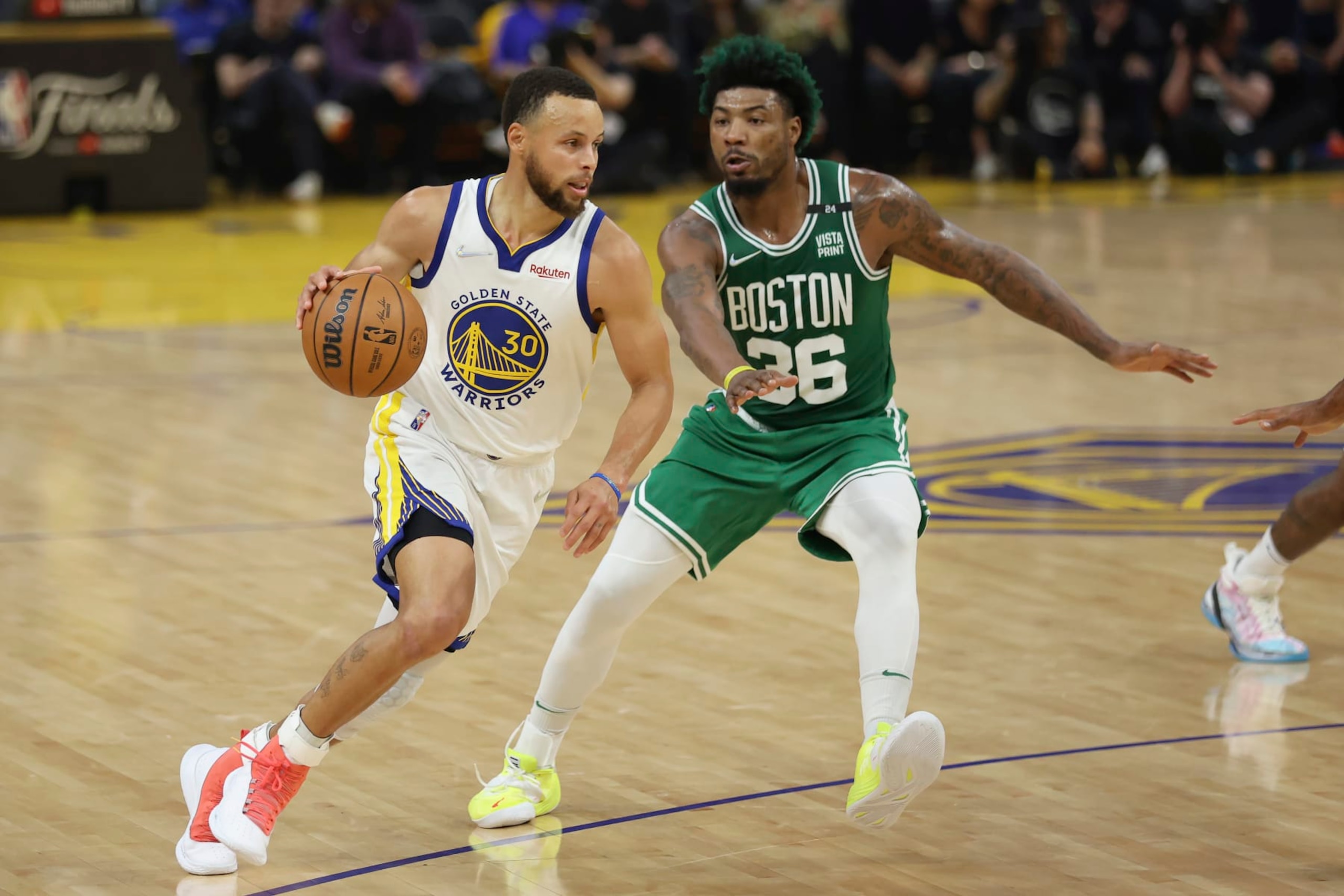 Golden State Warriors guard Stephen Curry (30) drives to the basket against Boston Celtics guard Marcus Smart (36) during Game 2 of basketball's NBA Finals in San Francisco, Sunday, June 5, 2022. (AP Photo/Jed Jacobsohn)