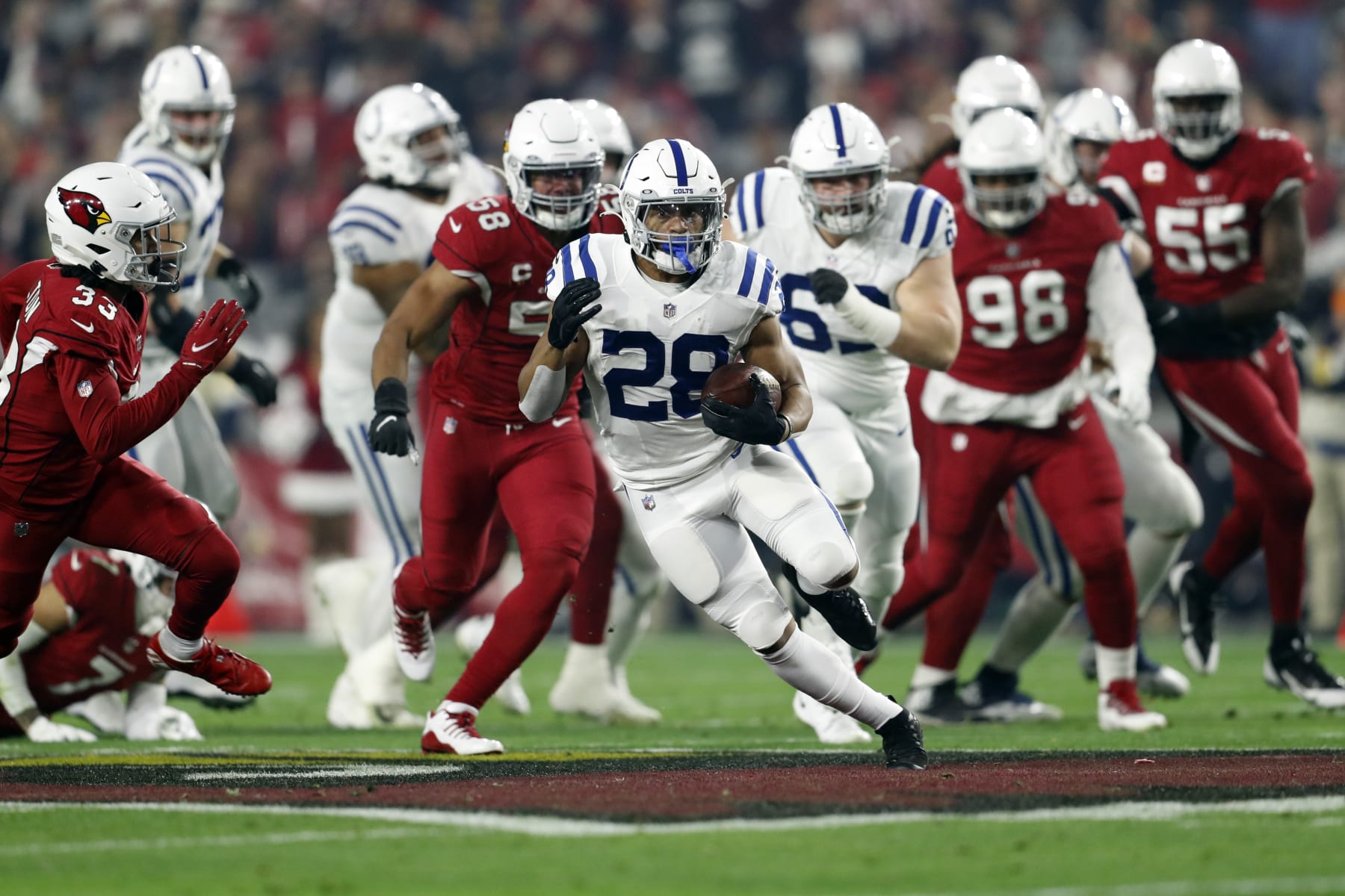 GLENDALE, ARIZONA - DECEMBER 25: Running back Jonathan Taylor #28 of the Indianapolis Colts runs during the first half of the game against the Arizona Cardinals at State Farm Stadium on December 25, 2021 in Glendale, Arizona. The Colts beat the Cardinals 22-16. (Photo by Chris Coduto/Getty Images)
