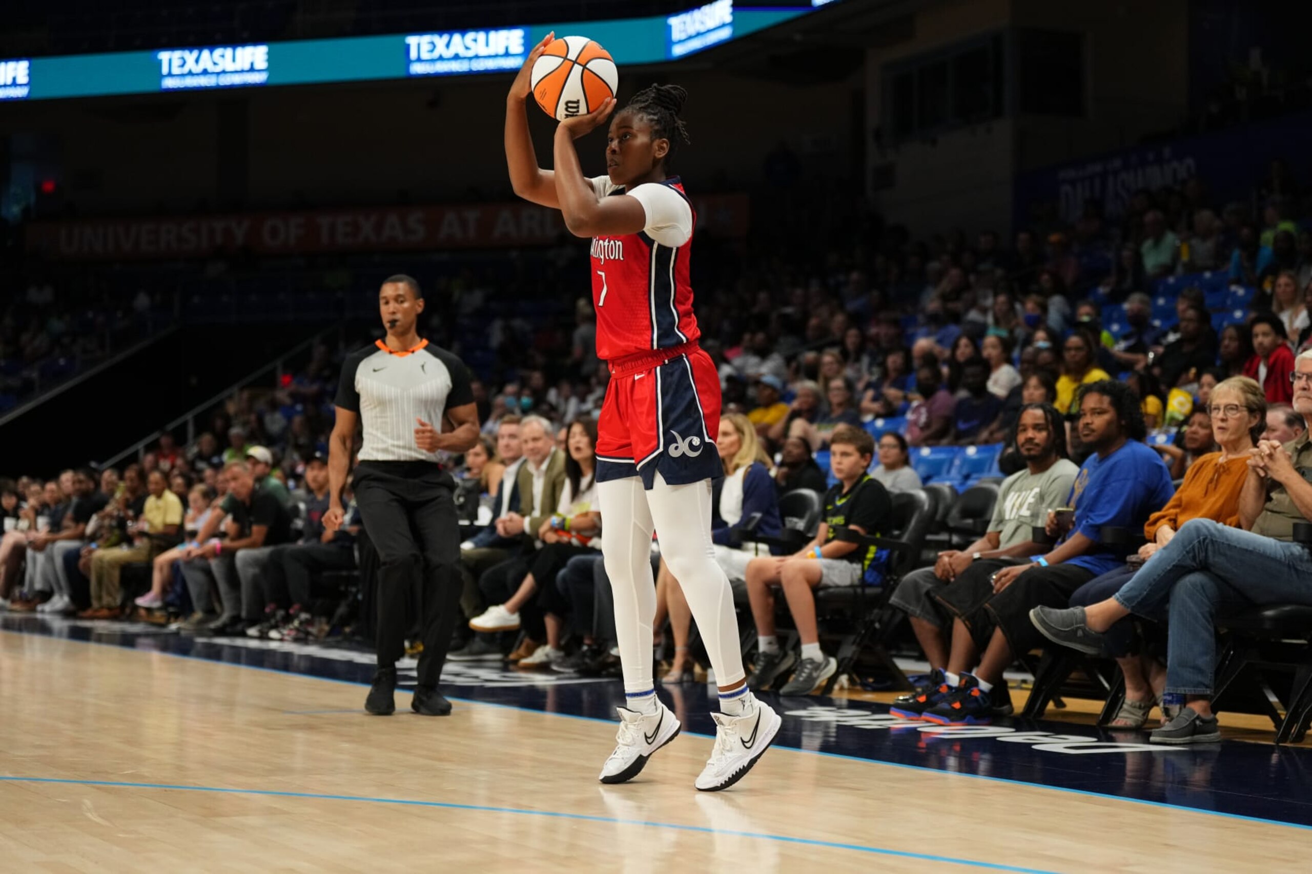 ARLINGTON, TX - JULY 28: Ariel Atkins #7 of the Washington Mystics shoots a three point basket during the game against the Dallas Wings on July 28, 2022 at the College Park Center in Arlington, Texas. NOTE TO USER: User expressly acknowledges and agrees that, by downloading and/or using this Photograph, user is consenting to the terms and conditions of the Getty Images License Agreement. Mandatory Copyright Notice: Copyright 2022 NBAE (Photo by Cooper Neill/NBAE via Getty Images)