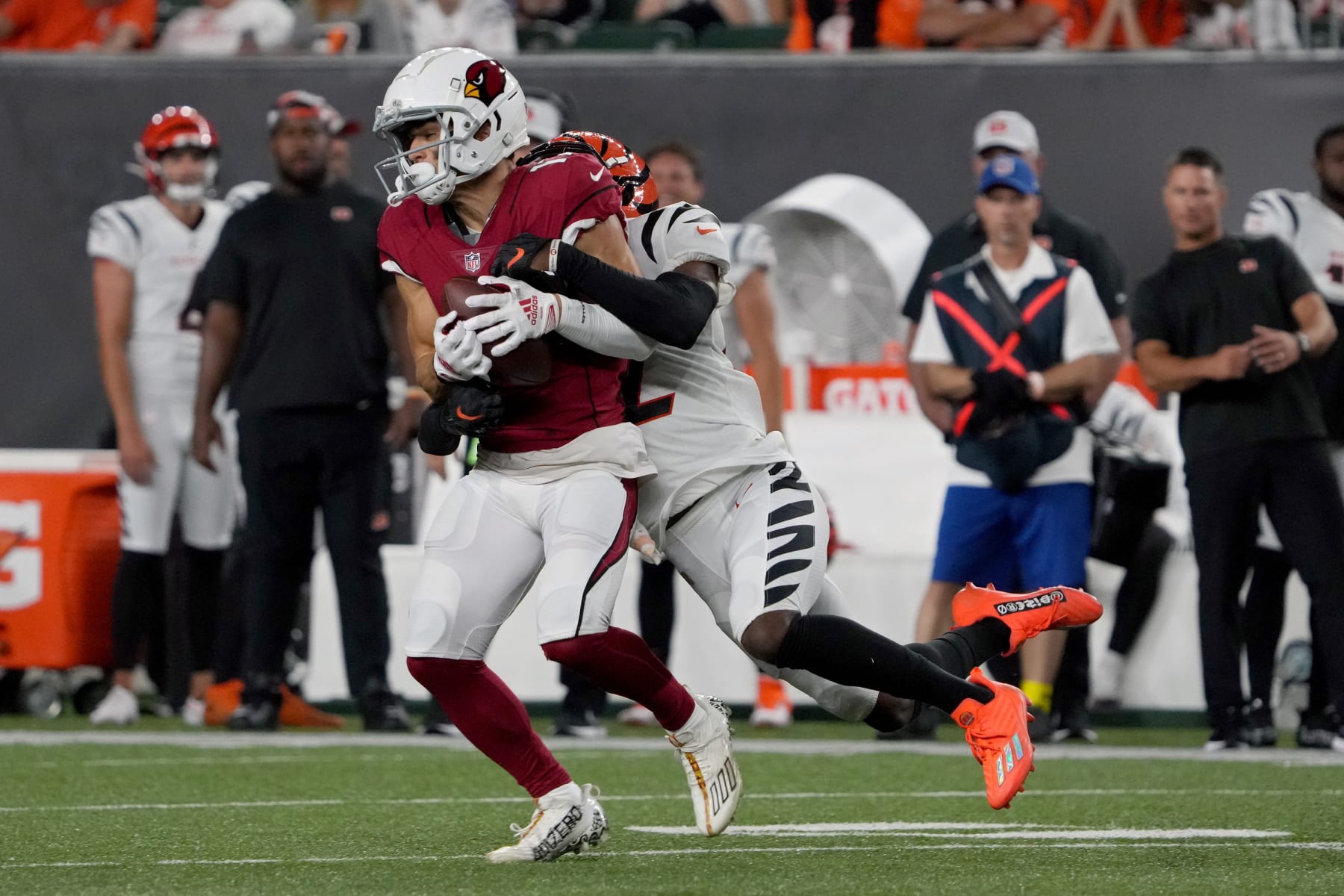 CINCINNATI, OHIO - AUGUST 12: Andy Isabella #17 of the Arizona Cardinals runs with the ball while being tackled by Allan George #42 of the Cincinnati Bengals in the third quarter during a preseason game at Paycor Stadium on August 12, 2022 in Cincinnati, Ohio. (Photo by Dylan Buell/Getty Images)