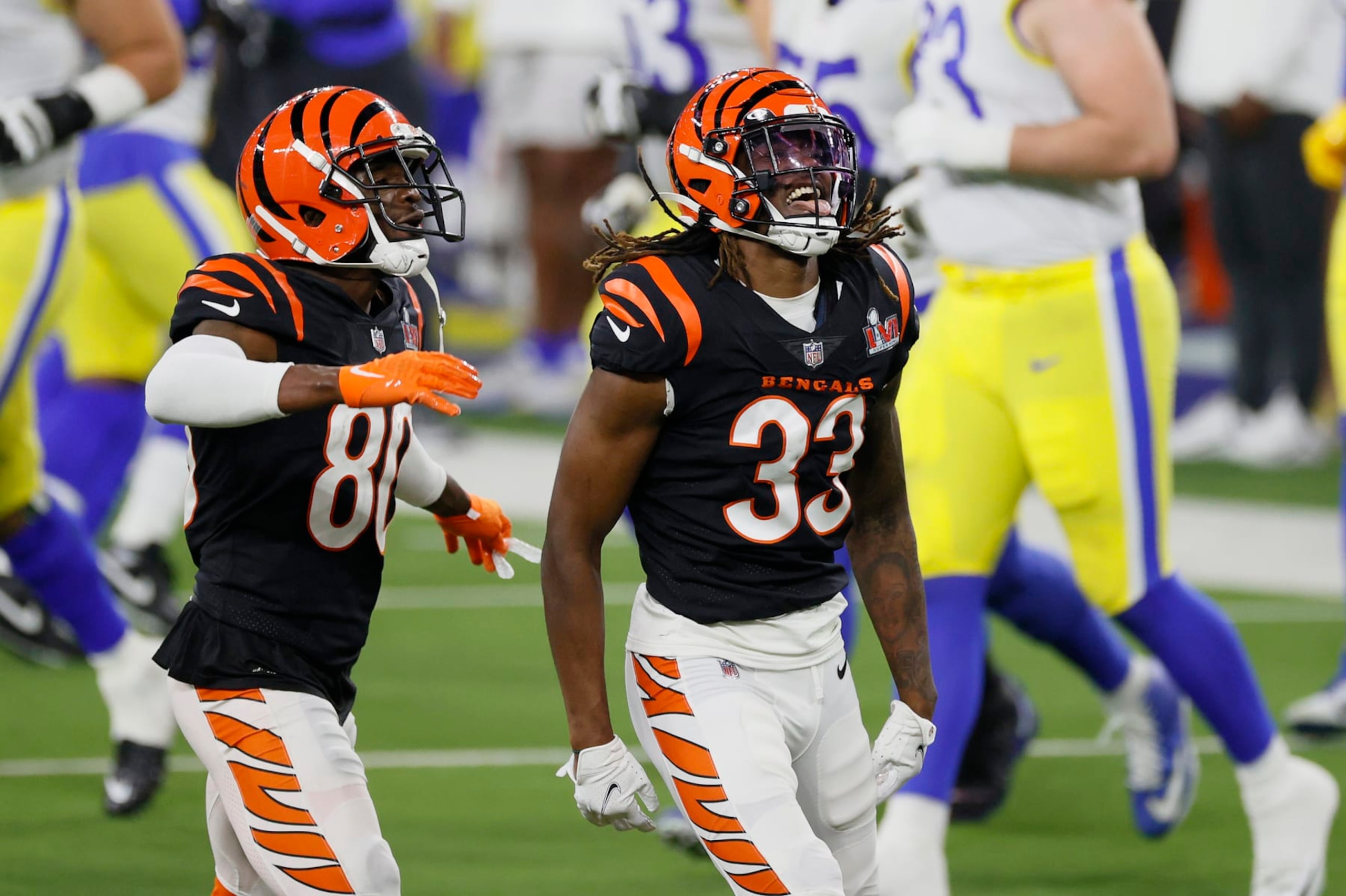 INGLEWOOD, CALIFORNIA - FEBRUARY 13: Tre Flowers #33 and Mike Thomas #80 of the Cincinnati Bengals react during Super Bowl LVI at SoFi Stadium on February 13, 2022 in Inglewood, California. The Los Angeles Rams defeated the Cincinnati Bengals 23-20.  (Photo by Steph Chambers/Getty Images)