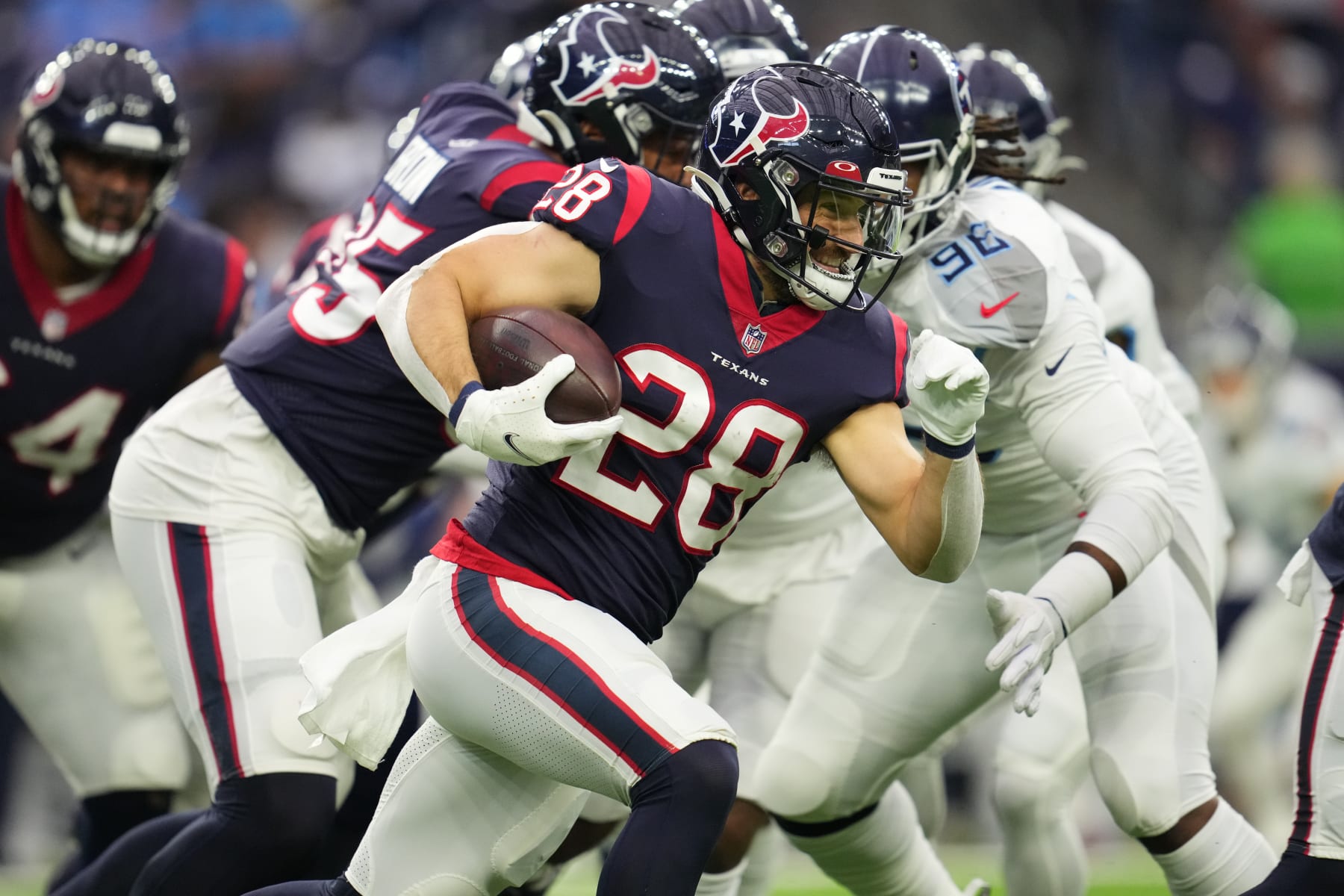 HOUSTON, TEXAS - JANUARY 09: Rex Burkhead #28 of the Houston Texans runs the ball against the Tennessee Titans during an NFL game at NRG Stadium on January 09, 2022 in Houston, Texas. (Photo by Cooper Neill/Getty Images)
