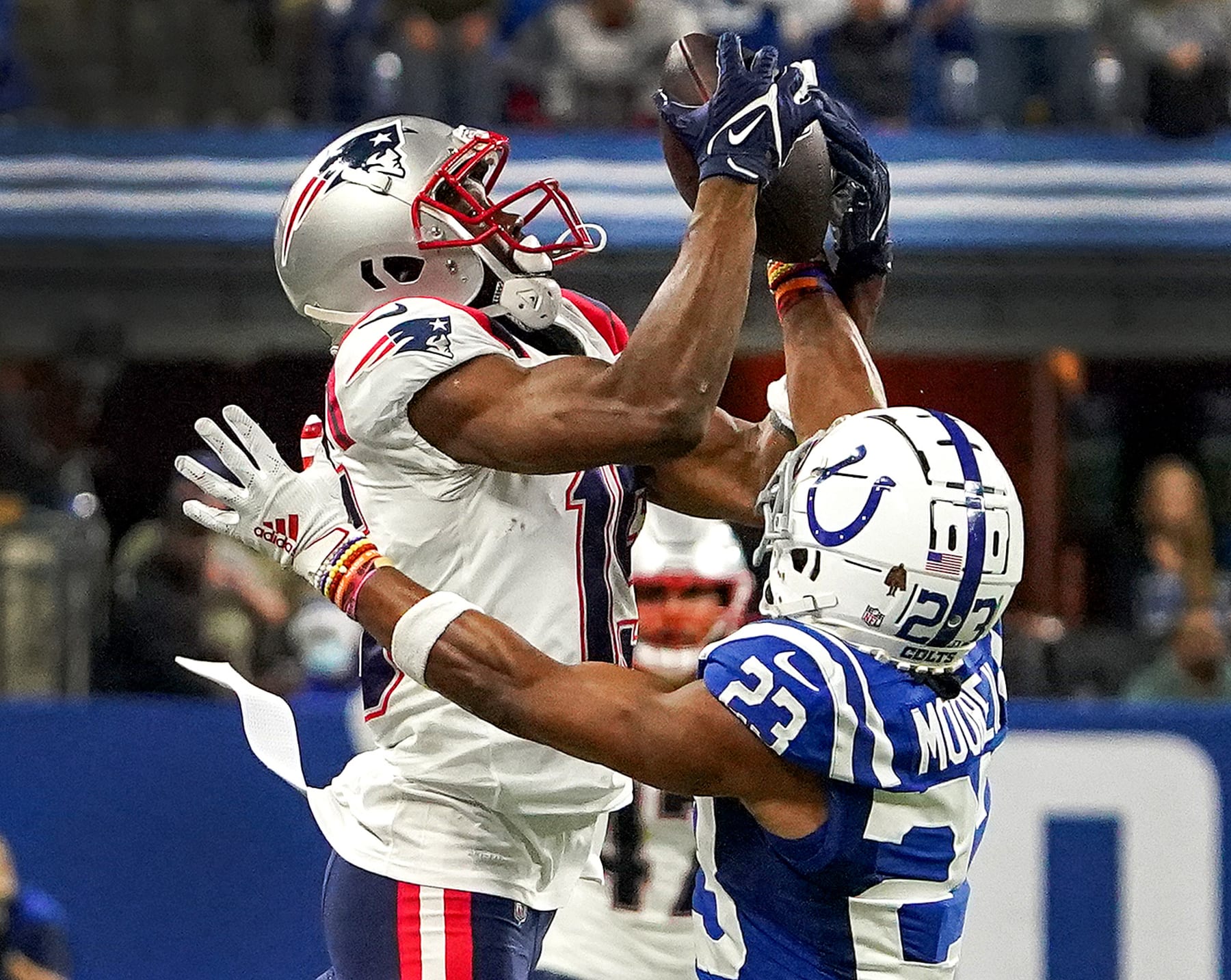 Indianapolis, IN - December 18: Indianapolis Colts cornerback Kenny Moore II (23) breaks up a pass intended for New England Patriots wide receiver Nelson Agholor (15) during the third quarter.. The Indianapolis Colts host the New England Patriots on December 18, 2021 in a Saturday night NFL game at Lucas Oil Stadium in Indianapolis, IN. (Photo by Barry Chin/The Boston Globe via Getty Images)