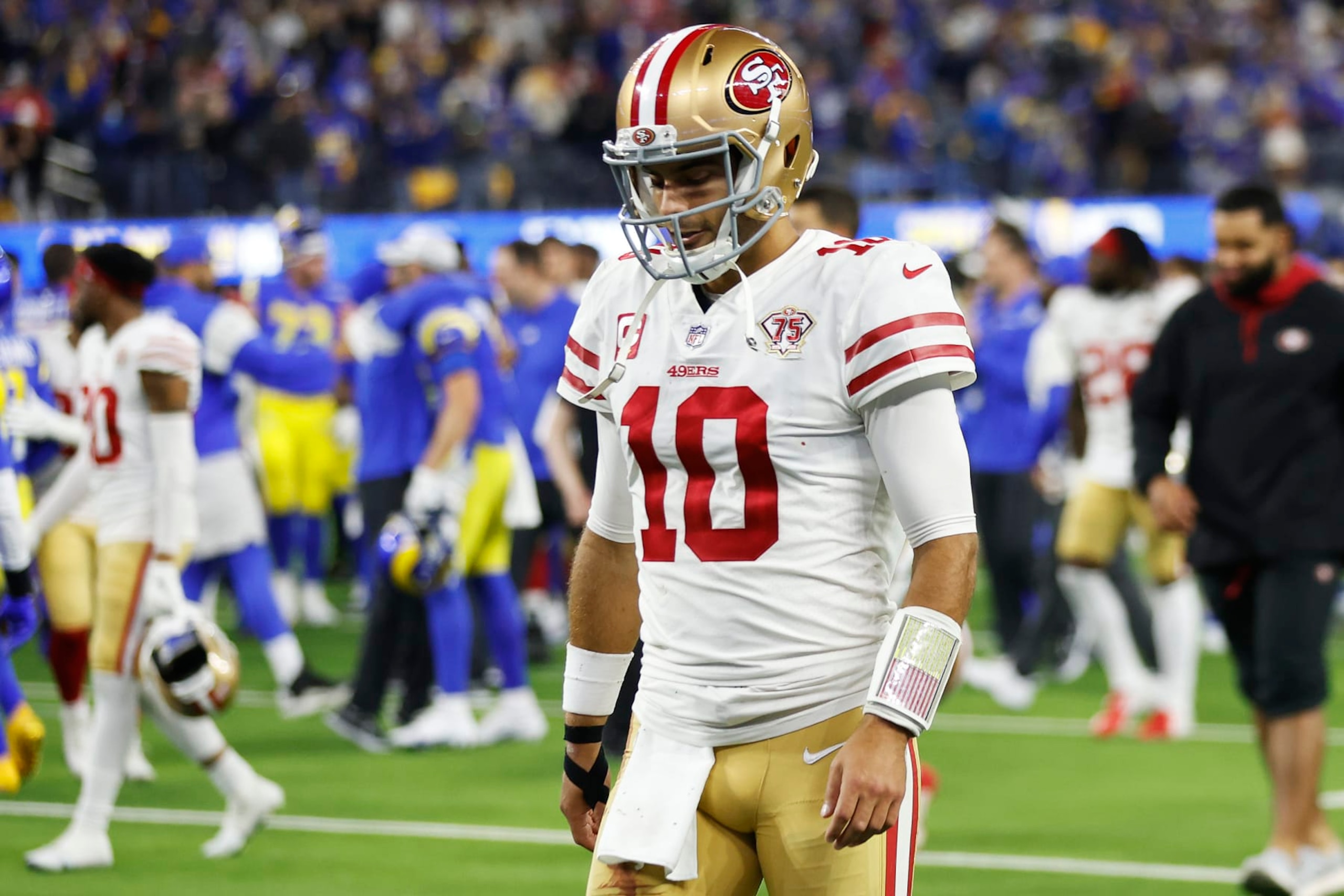 INGLEWOOD, CALIFORNIA - JANUARY 30: Jimmy Garoppolo #10 of the San Francisco 49ers walks off the field after being defeated by the Los Angeles Rams in the NFC Championship Game at SoFi Stadium on January 30, 2022 in Inglewood, California. The Rams defeated the 49ers 20-17. (Photo by Christian Petersen/Getty Images)