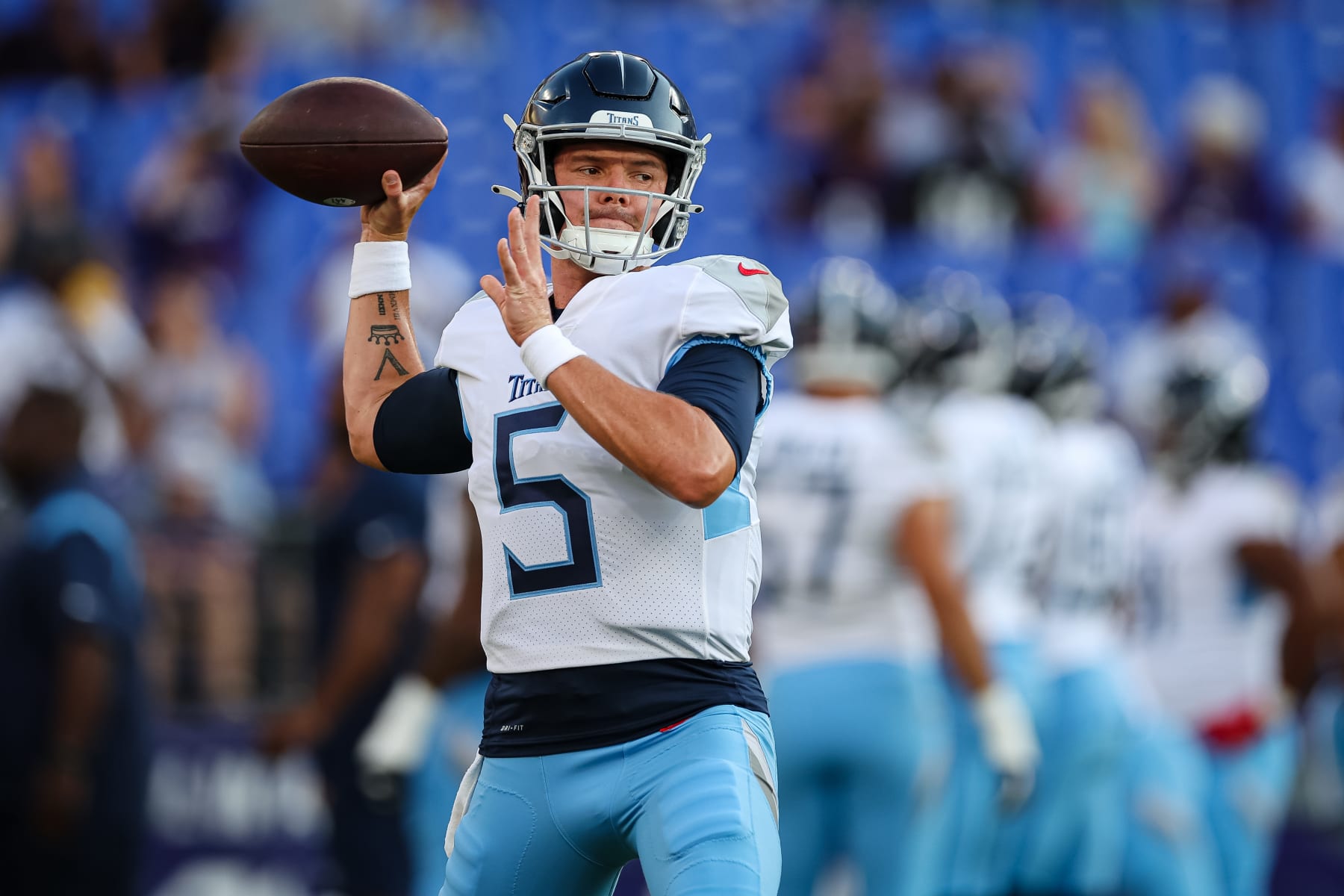 BALTIMORE, MD - AUGUST 11: Logan Woodside #5  of the Tennessee Titans attempts a pass before the game against the Baltimore Ravens at M&T Bank Stadium on August 11, 2022 in Baltimore, Maryland. (Photo by Scott Taetsch/Getty Images)