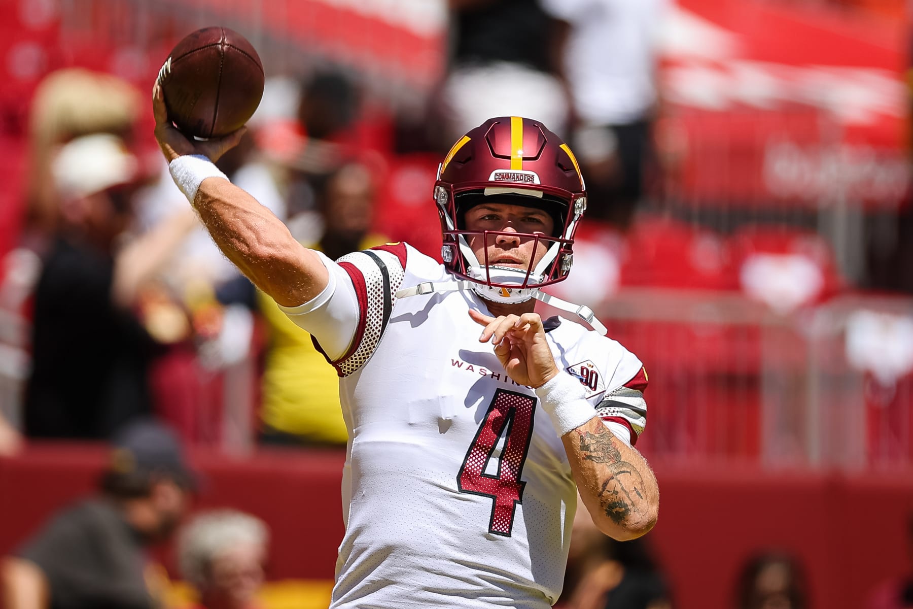 LANDOVER, MD - AUGUST 13: Taylor Heinicke #4 of the Washington Commanders attempts a pass before the preseason game against the Carolina Panthers at FedExField on August 13, 2022 in Landover, Maryland. (Photo by Scott Taetsch/Getty Images)