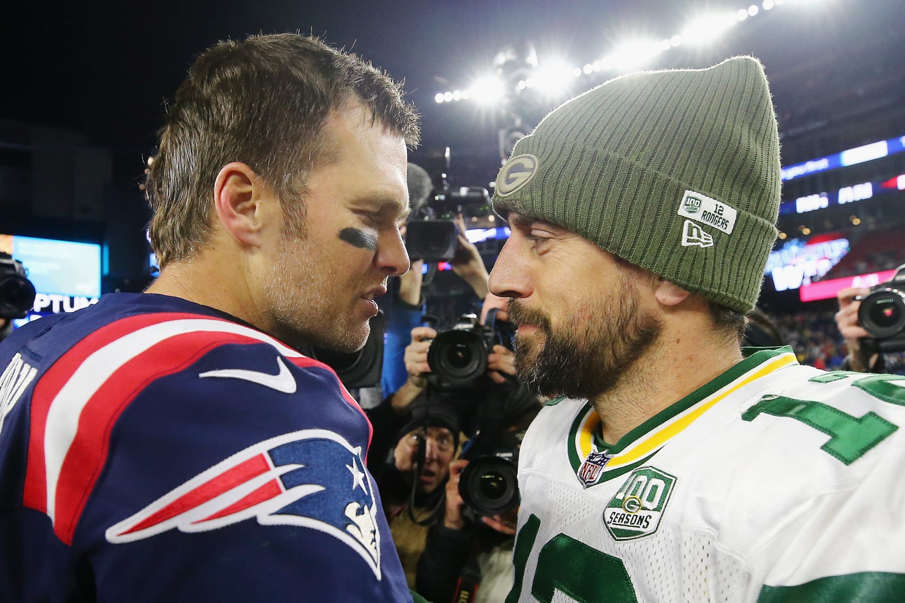 FOXBOROUGH, MA - NOVEMBER 04:  Tom Brady #12 of the New England Patriots talks with Aaron Rodgers #12 of the Green Bay Packers after the Patriots defeated the Packers 31-17 at Gillette Stadium on November 4, 2018 in Foxborough, Massachusetts.  (Photo by Maddie Meyer/Getty Images)