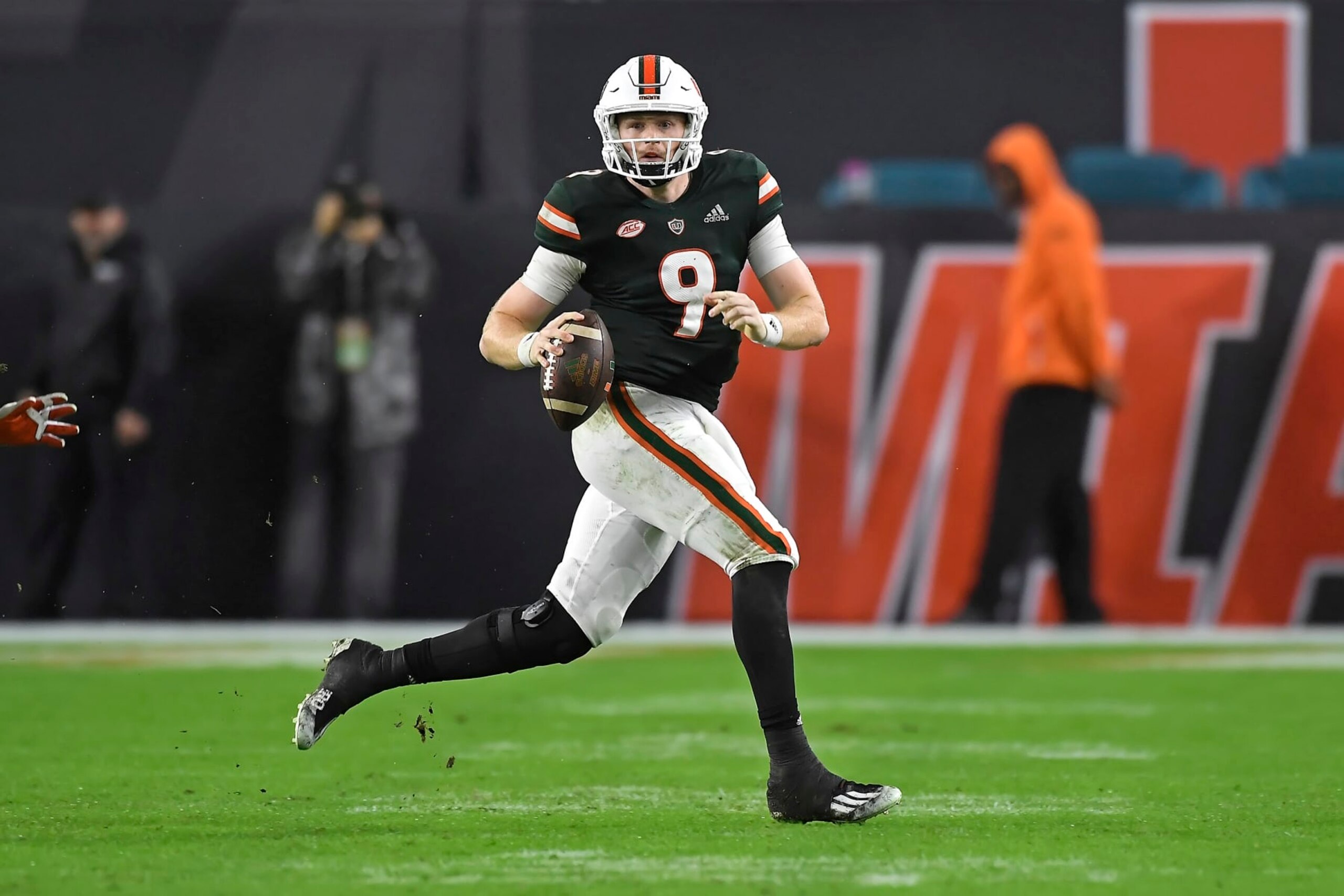 MIAMI GARDENS, FL - NOVEMBER 20:  Miami quarterback Tyler Van Dyke (9) scrambles in the fourth quarter as the University of Miami Hurricanes faced the Virginia Tech Hokies on November 20, 2021, at Hard Rock Stadium in Miami Gardens, Florida. (Photo by Samuel Lewis/Icon Sportswire via Getty Images)