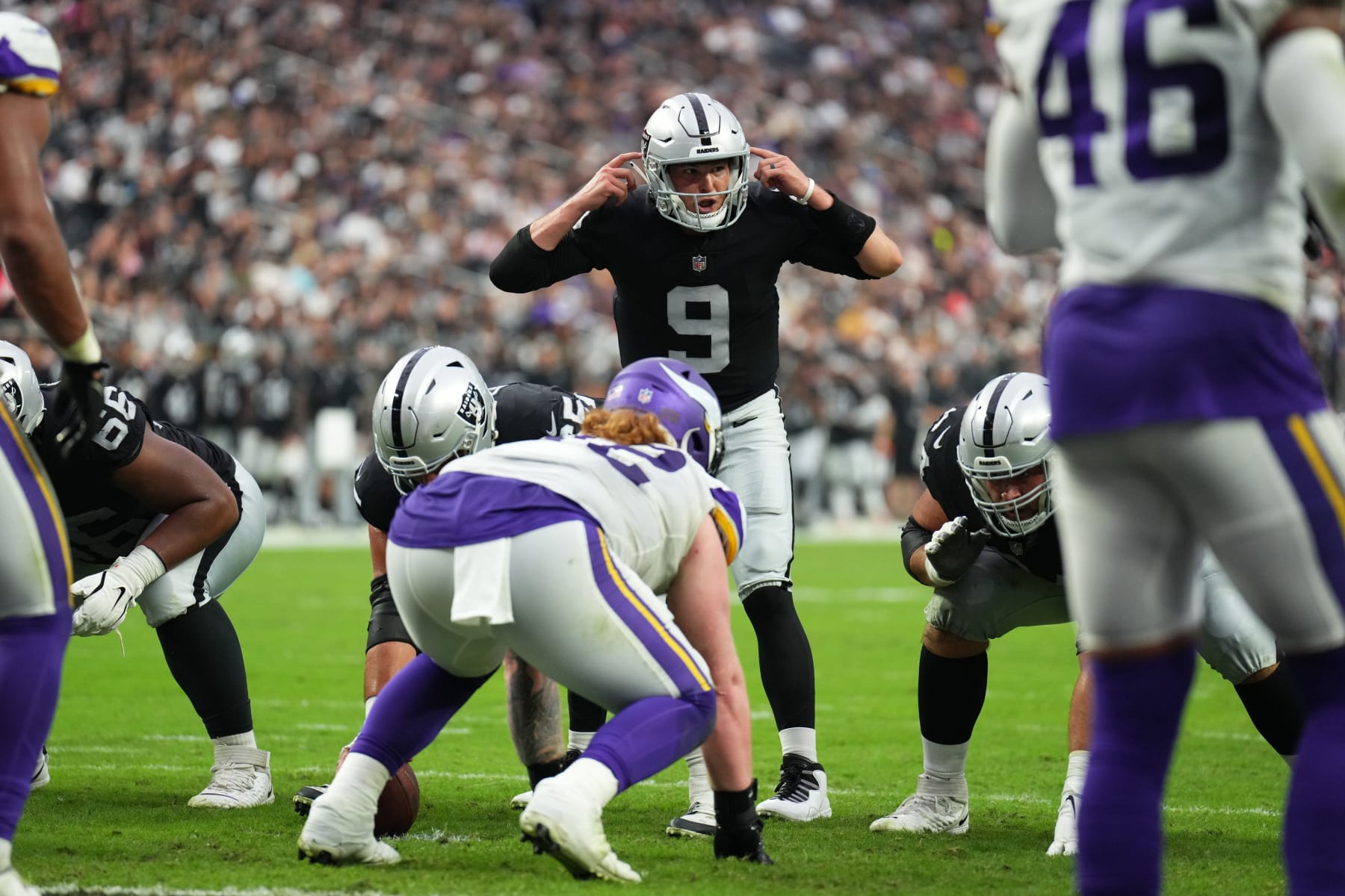 LAS VEGAS, NEVADA - AUGUST 14:  Quarterback Nick Mullens #9 of the Las Vegas Raiders signals at the line of scrimmage during the second half of a preseason game against the Minnesota Vikings at Allegiant Stadium on August 14, 2022 in Las Vegas, Nevada. (Photo by Chris Unger/Getty Images)