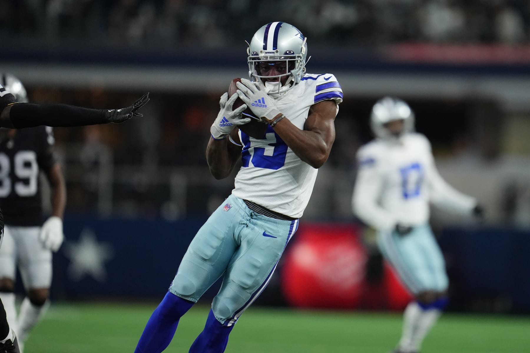 ARLINGTON, TEXAS - NOVEMBER 25: Michael Gallup #13 of the Dallas Cowboys makes the catch against the Las Vegas Raiders during an NFL game at AT&T Stadium on November 25, 2021 in Arlington, Texas. (Photo by Cooper Neill/Getty Images)