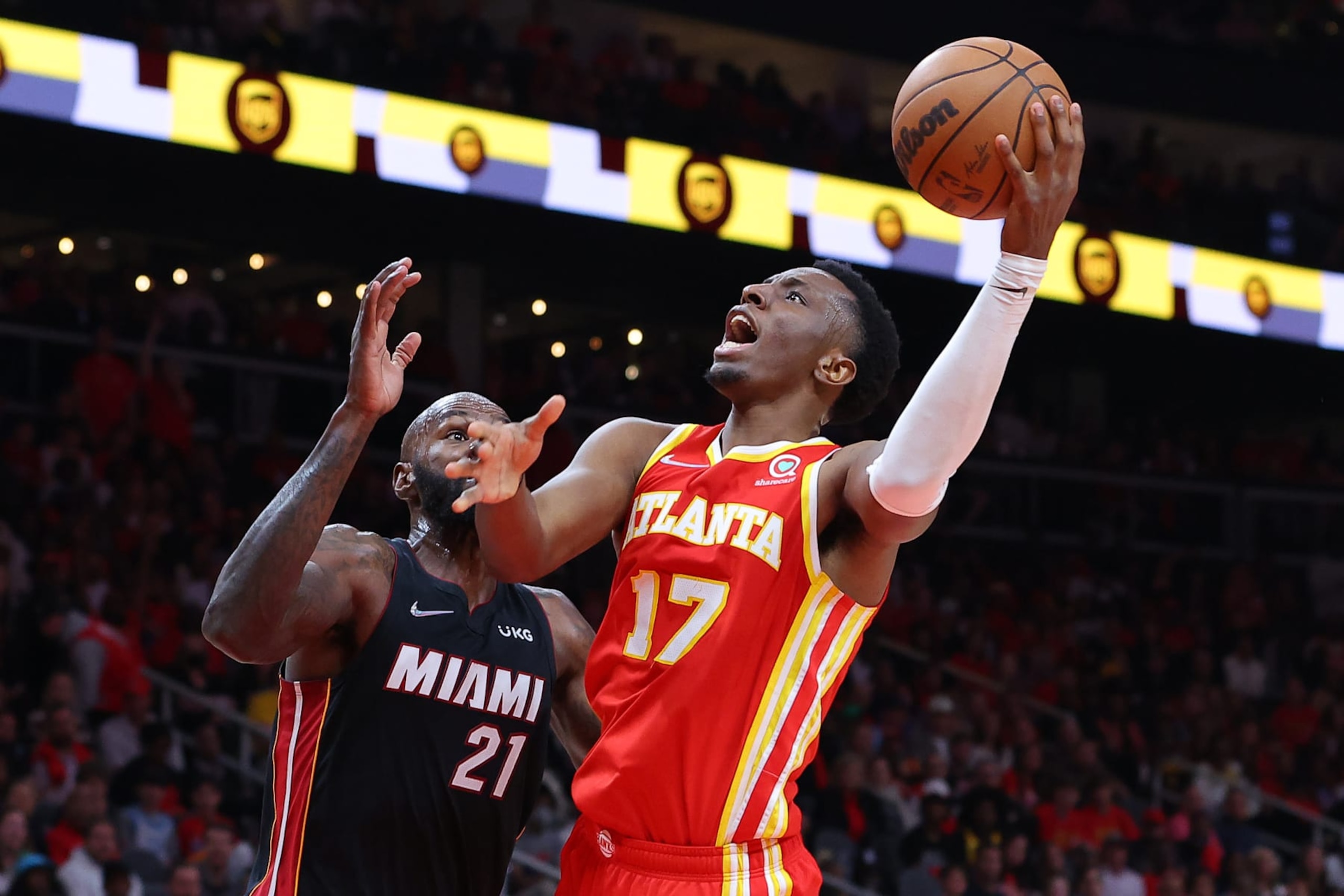 ATLANTA, GEORGIA - APRIL 22: Onyeka Okongwu #17 of the Atlanta Hawks shoots against Dewayne Dedmon #21 of the Miami Heat during second half in Game Three of the Eastern Conference First Round at State Farm Arena on April 22, 2022 in Atlanta, Georgia. NOTE TO USER: User expressly acknowledges and agrees that, by downloading and or using this photograph, User is consenting to the terms and conditions of the Getty Images License Agreement. (Photo by Kevin C. Cox/Getty Images) ATLANTA, GEORGIA - APRIL 22: Onyeka Okongwu #17 of the Atlanta Hawks shoots against Dewayne Dedmon #21 of the Miami Heat during second half in Game Three of the Eastern Conference First Round at State Farm Arena on April 22, 2022 in Atlanta, Georgia. NOTE TO USER: User expressly acknowledges and agrees that, by downloading and or using this photograph, User is consenting to the terms and conditions of the Getty Images License Agreement. (Photo by Kevin C. Cox/Getty Images)