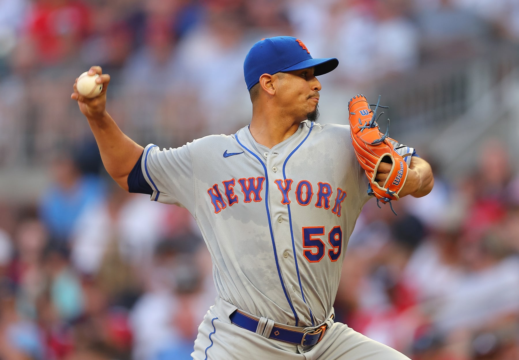 ATLANTA, GA - AUGUST 15:  Carlos Carrasco #59 of the New York Mets pitches in the first inning against the Atlanta Braves at Truist Park on August 15, 2022 in Atlanta, Georgia. (Photo by Kevin C. Cox/Getty Images)
