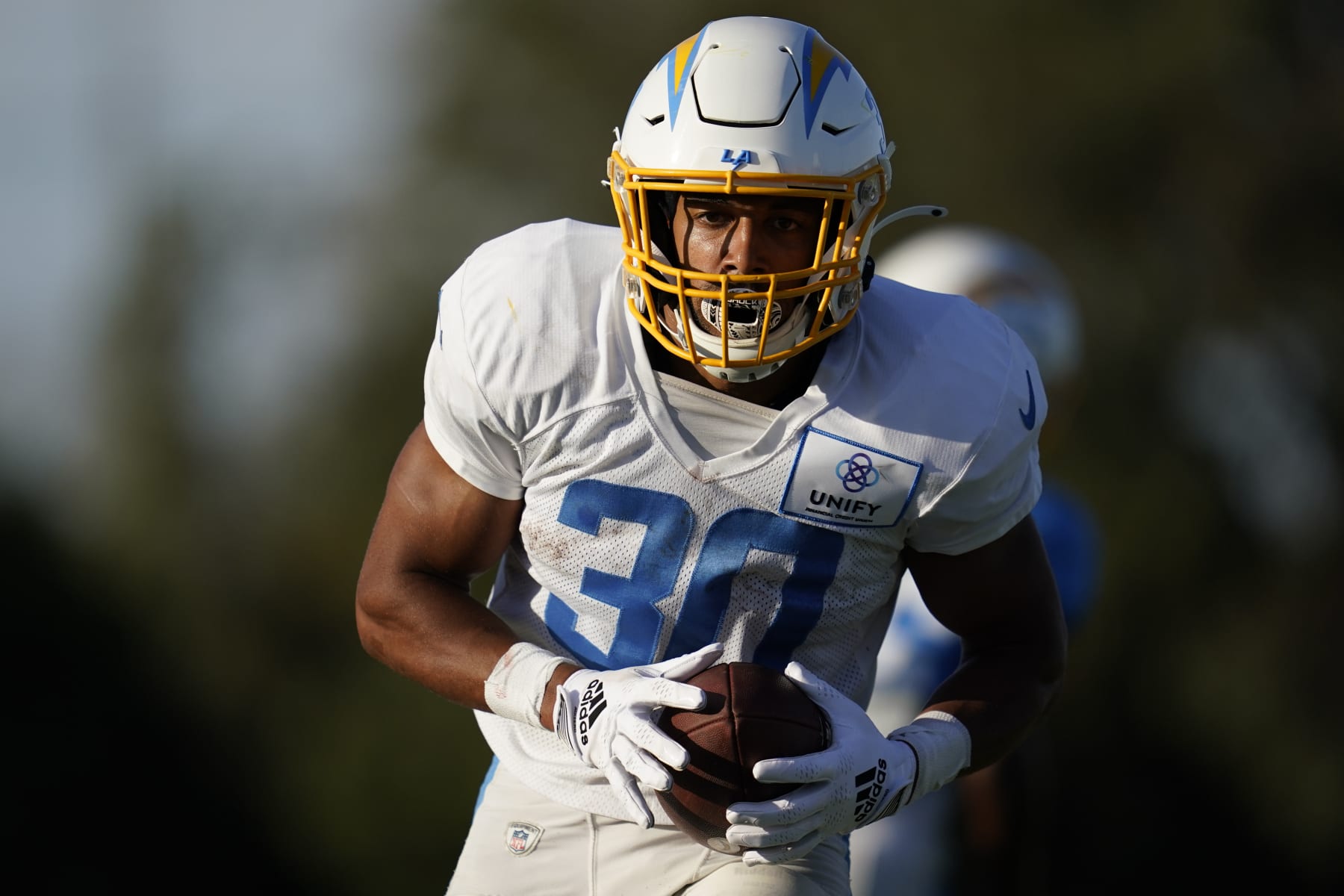 Los Angeles Chargers running back Austin Ekeler (30) participates in drills at the NFL football team's practice facility in Costa Mesa, Calif. Sunday, Aug. 7, 2022. (AP Photo/Ashley Landis)