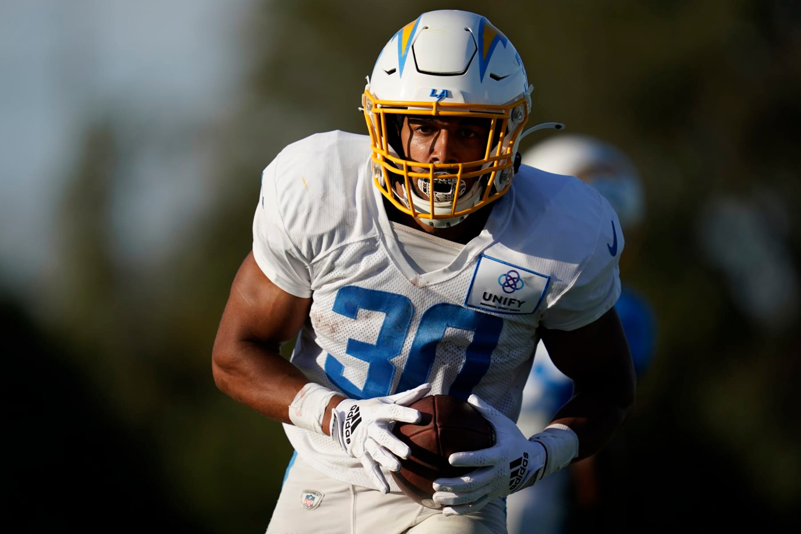 Los Angeles Chargers running back Austin Ekeler (30) participates in drills at the NFL football team's practice facility in Costa Mesa, Calif. Sunday, Aug. 7, 2022. (AP Photo/Ashley Landis)