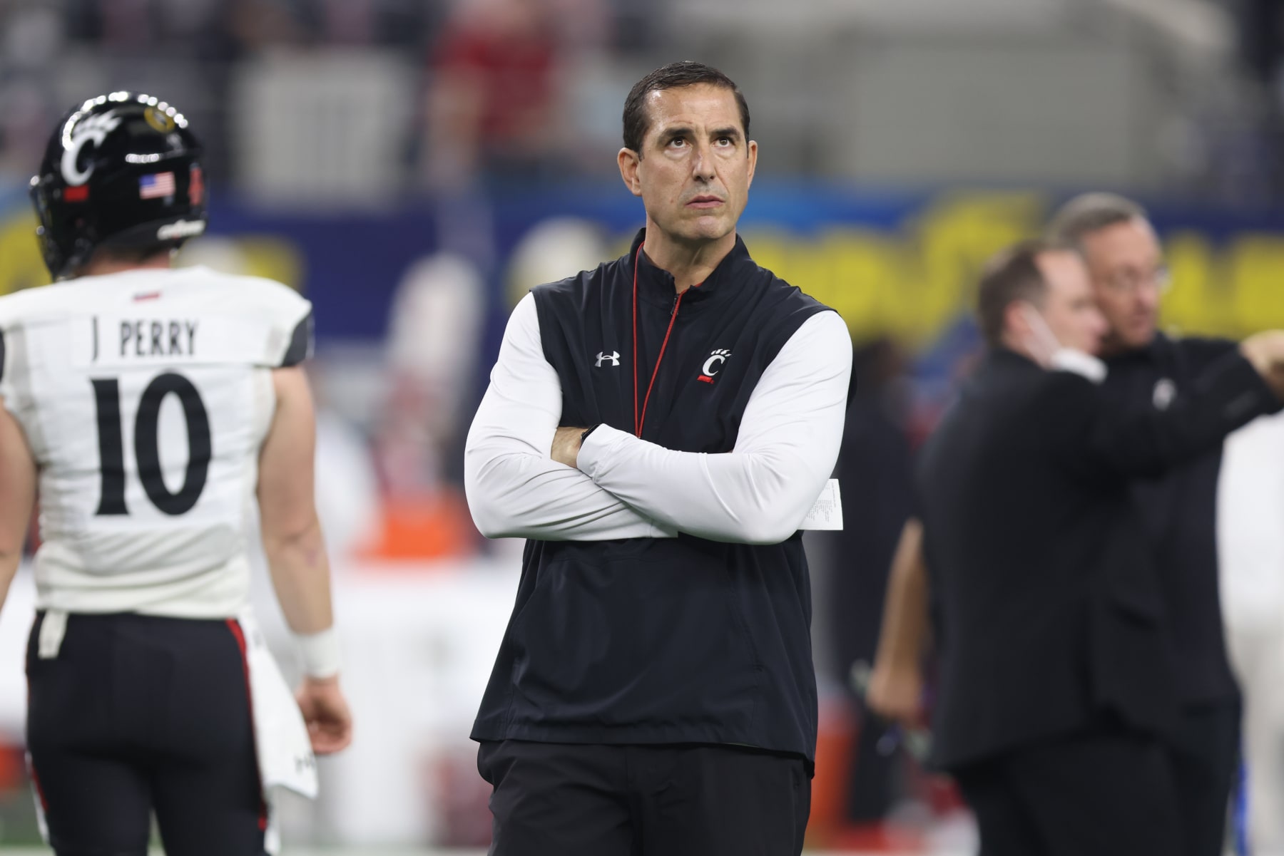ARLINGTON, TX - DECEMBER 31: CIncinnati coach Luke Fickell watches his team warm up before the Goodyear Cotton Bowl between the Alabama Crimson Tide and the Cincinnati Bearcats on December 31, 2021 in AT&T Stadium in Arlington, TX. (Photo by John Bunch/Icon Sportswire via Getty Images