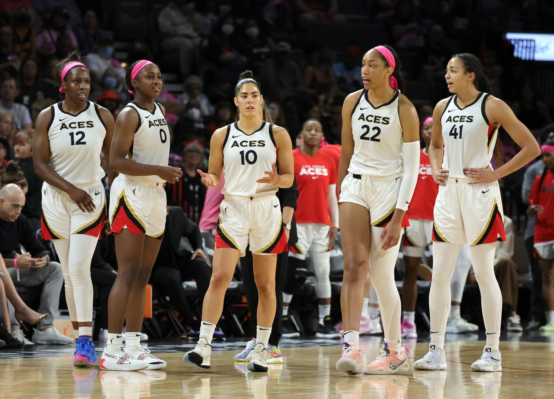 LAS VEGAS, NEVADA - AUGUST 11: Chelsea Gray #12, Jackie Young #0, Kelsey Plum #10, A'ja Wilson #22 and Kiah Stokes #41 of the Las Vegas Aces walk back on the court after a timeout in their game against the Chicago Sky at Michelob ULTRA Arena on August 11, 2022 in Las Vegas, Nevada. The Aces defeated the Sky 89-78. NOTE TO USER: User expressly acknowledges and agrees that, by downloading and or using this photograph, User is consenting to the terms and conditions of the Getty Images License Agreement. (Photo by Ethan Miller/Getty Images)