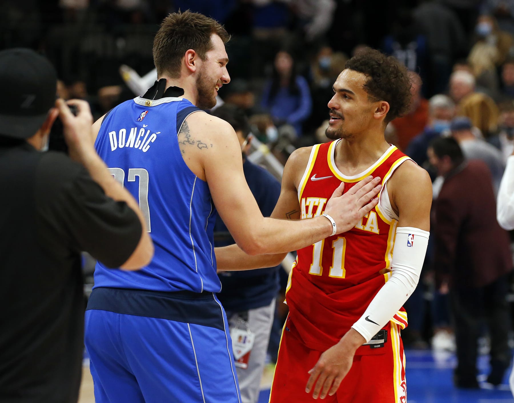 DALLAS, TEXAS - FEBRUARY 06: Luka Doncic #77 of the Dallas Mavericks has a moment with Trae Young #11 of the Atlanta Hawks after the game at American Airlines Center on February 06, 2022 in Dallas, Texas. NOTE TO USER: User expressly acknowledges and agrees that, by downloading and or using this photograph, User is consenting to the terms and conditions of the Getty Images License Agreement. (Photo by Richard Rodriguez/Getty Images)