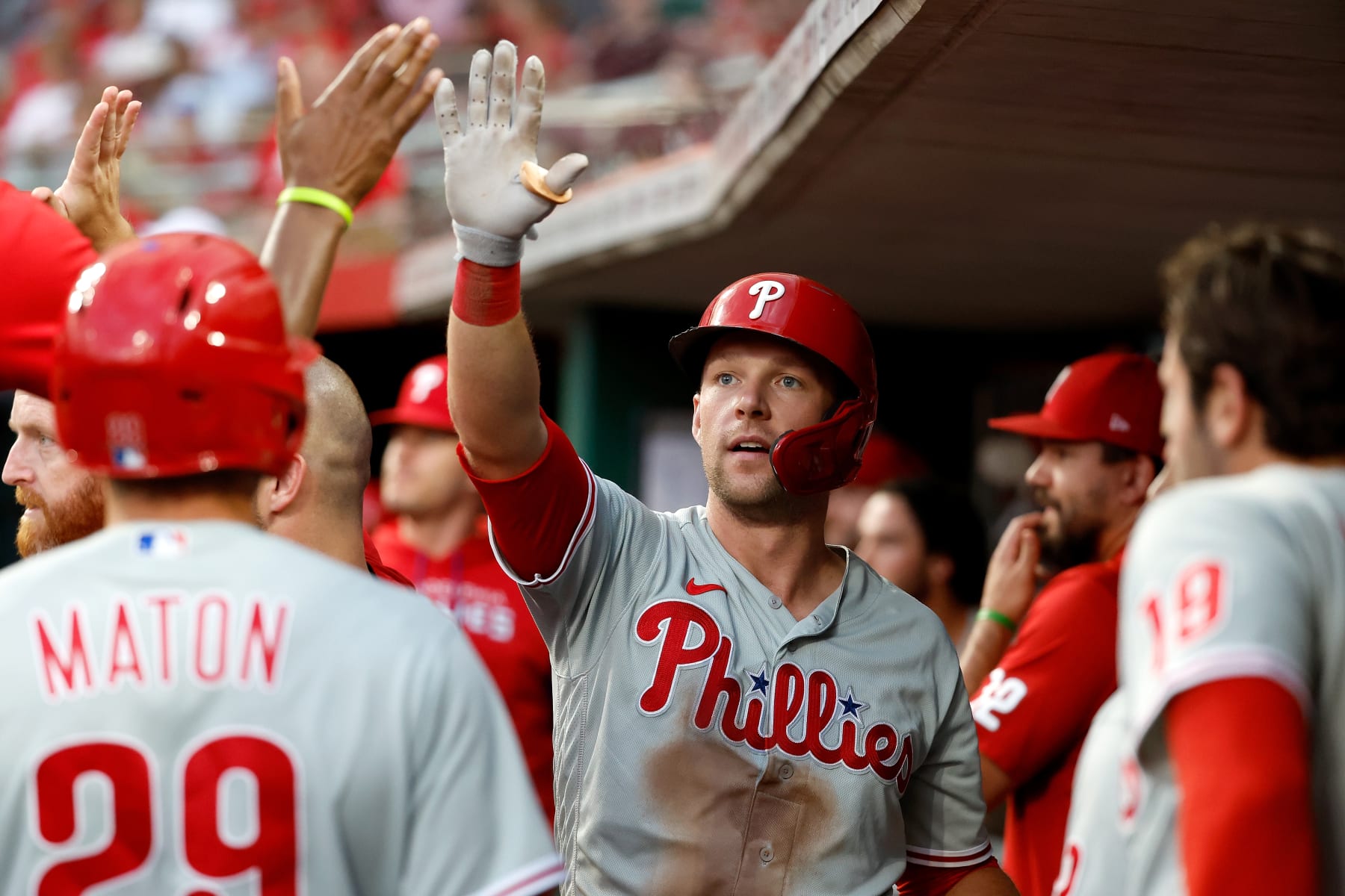 CINCINNATI, OH - AUGUST 16:  Rhys Hoskins #17 of the Philadelphia Phillies is congratulated after hitting a three-run home run during the fourth inning of the game against the Cincinnati Reds at Great American Ball Park on August 16, 2022 in Cincinnati, Ohio. (Photo by Kirk Irwin/Getty Images)