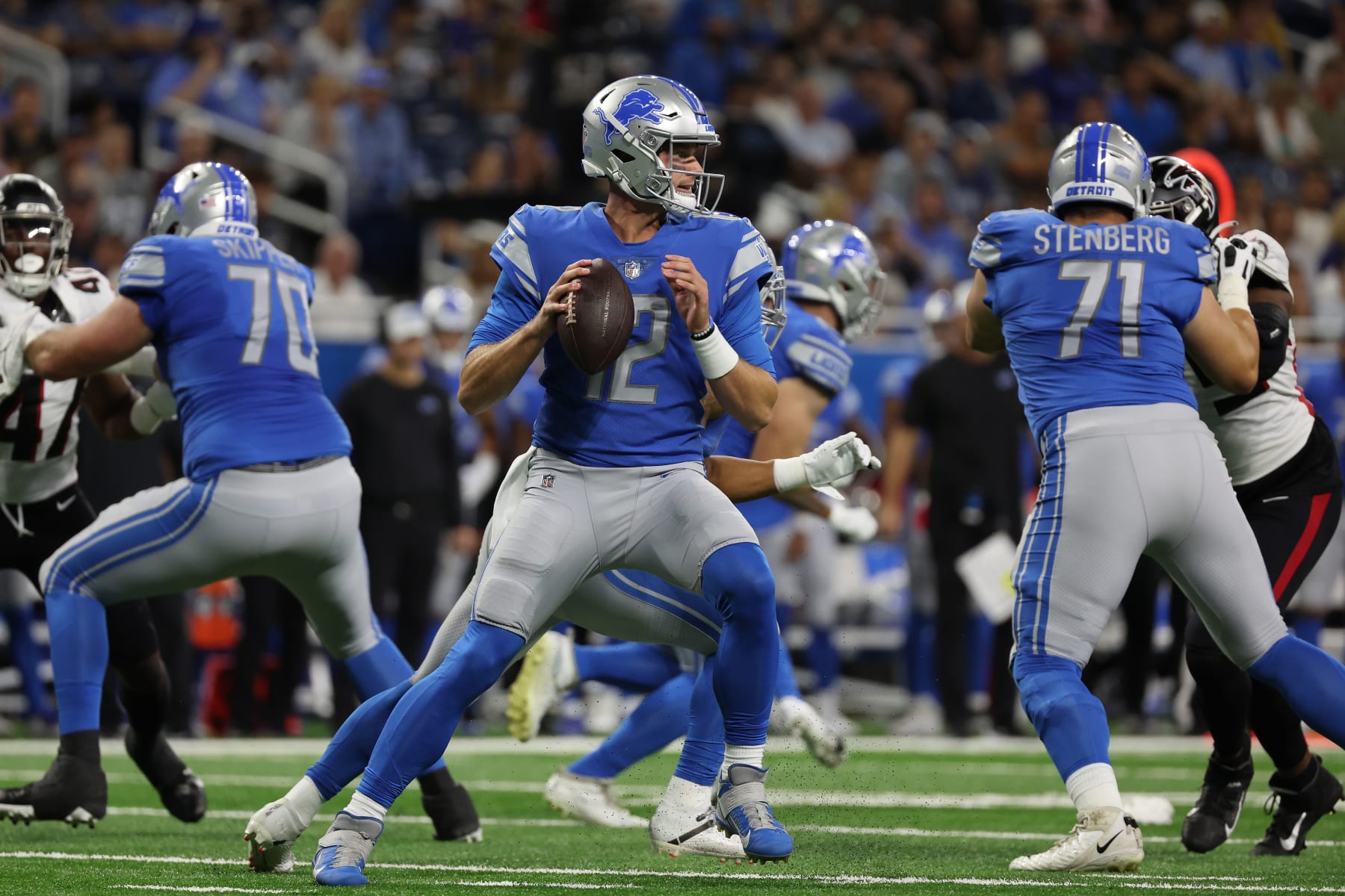 DETROIT, MICHIGAN - AUGUST 12: Tim Boyle #12 of the Detroit Lions plays against the Atlanta Falcons during a NFL preseason gamat Ford Field on August 12, 2022 in Detroit, Michigan. (Photo by Gregory Shamus/Getty Images)
