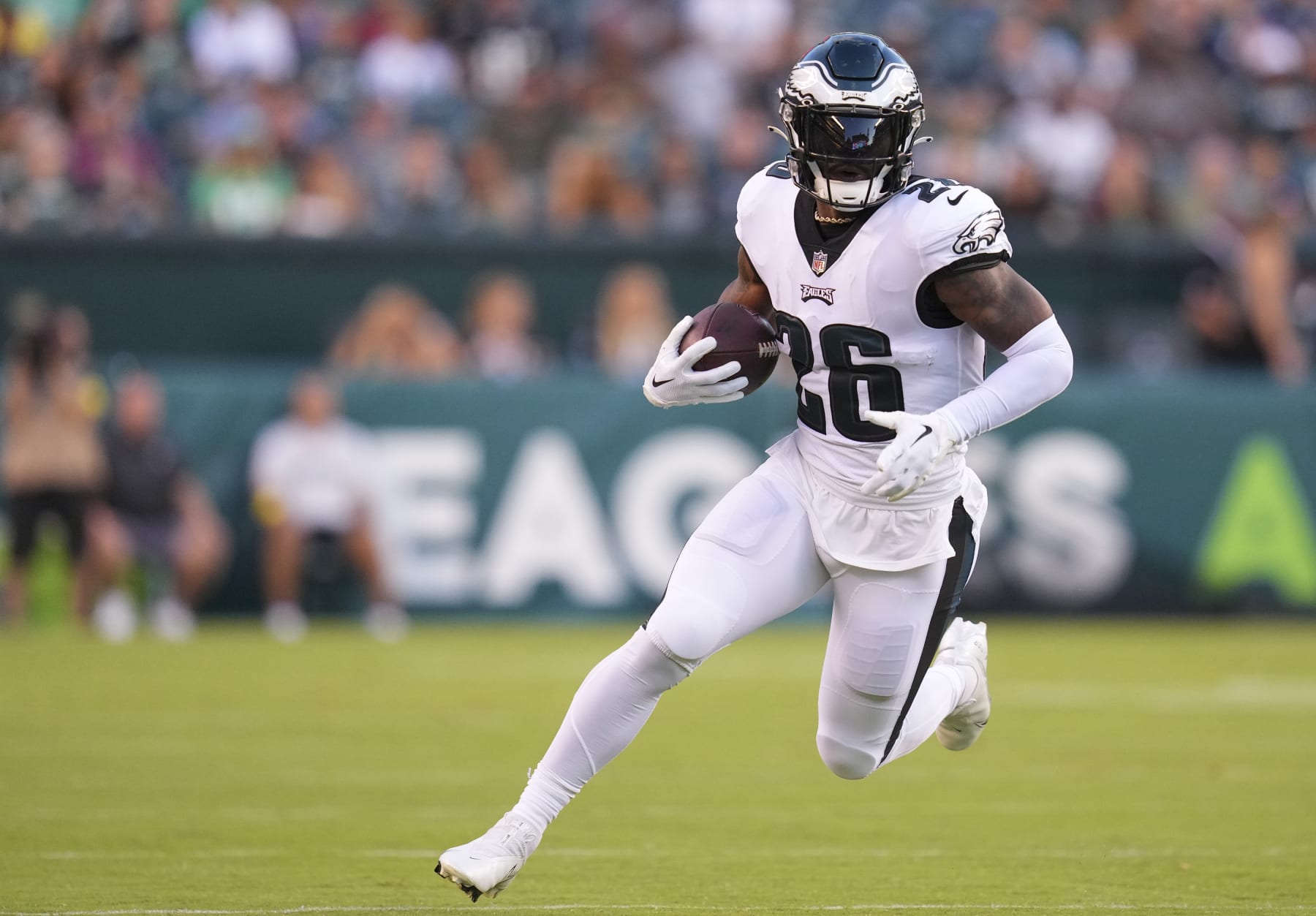 PHILADELPHIA, PA - AUGUST 12: Miles Sanders #26 of the Philadelphia Eagles runs with the ball against the New York Jets during the preseason game at Lincoln Financial Field on August 12, 2022 in Philadelphia, Pennsylvania. The Jets defeated the Eagles 24-21. (Photo by Mitchell Leff/Getty Images)