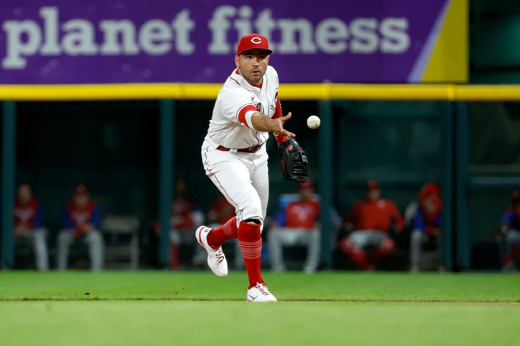CINCINNATI, OH - AUGUST 15:  Joey Votto #19 of the Cincinnati Reds flips the ball to first base during the game against the Philadelphia Phillies at Great American Ball Park on August 15, 2022 in Cincinnati, Ohio. Philadelphia defeated Cincinnati 4-3. (Photo by Kirk Irwin/Getty Images)