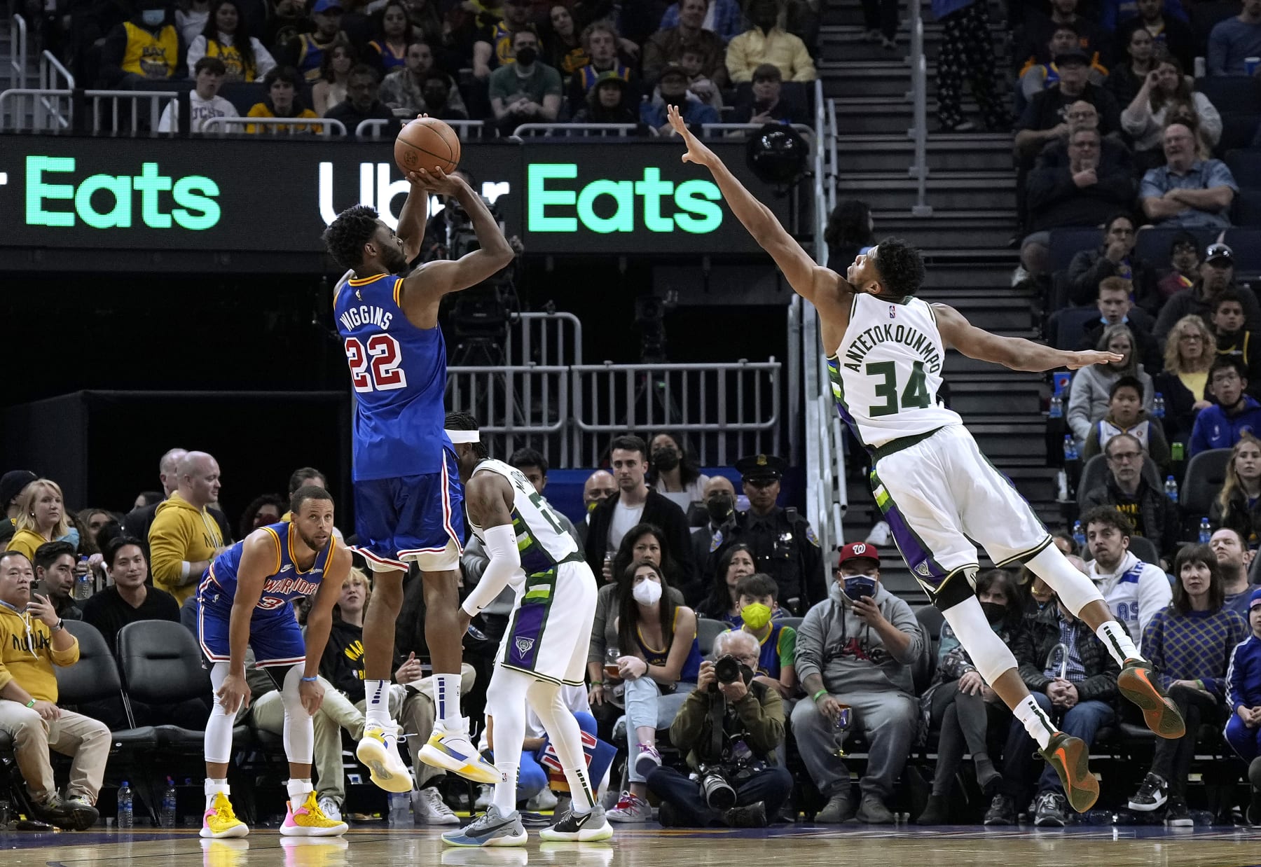 SAN FRANCISCO, CALIFORNIA - MARCH 12: Andrew Wiggins #22 of the Golden State Warriors shoots a three-point shot over Giannis Antetokounmpo #34 of the Milwaukee Bucks in the second half of an NBA basketball game at Chase Center on March 12, 2022 in San Francisco, California. NOTE TO USER: User expressly acknowledges and agrees that, by downloading and or using this photograph, User is consenting to the terms and conditions of the Getty Images License Agreement. (Photo by Thearon W. Henderson/Getty Images)