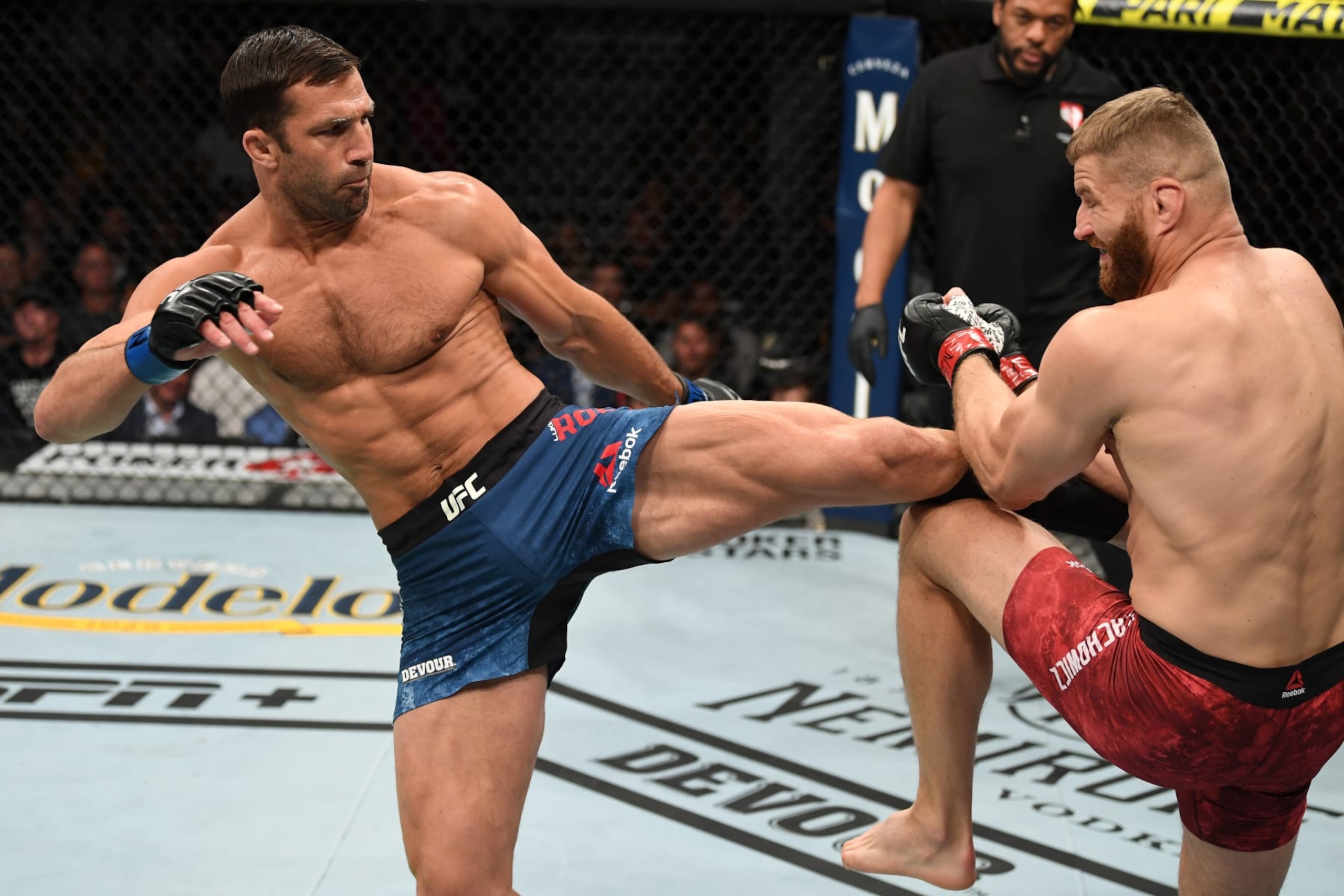 LAS VEGAS, NV - JULY 06: Luke Rockhold kicks Jan Blachowicz of Poland in their light heavyweight fight during the UFC 239 event at T-Mobile Arena on July 6, 2019 in Las Vegas, Nevada. (Photo by Josh Hedges/Zuffa LLC/Zuffa LLC) LAS VEGAS, NV - JULY 06: Luke Rockhold kicks Jan Blachowicz of Poland in their light heavyweight fight during the UFC 239 event at T-Mobile Arena on July 6, 2019 in Las Vegas, Nevada. (Photo by Josh Hedges/Zuffa LLC/Zuffa LLC)