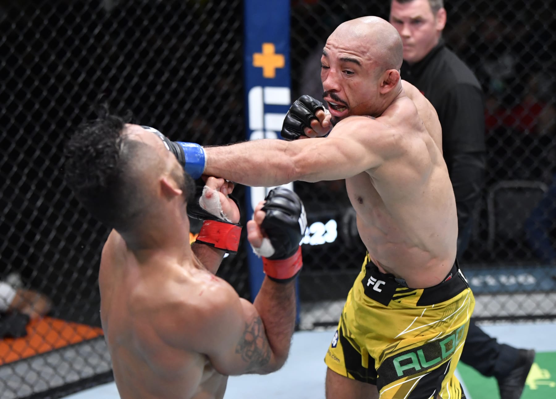 LAS VEGAS, NEVADA - DECEMBER 04: (R-L) Jose Aldo of Brazil punches Rob Font in their bantamweight fight during the UFC Fight Night event at UFC APEX on December 04, 2021 in Las Vegas, Nevada. (Photo by Jeff Bottari/Zuffa LLC)