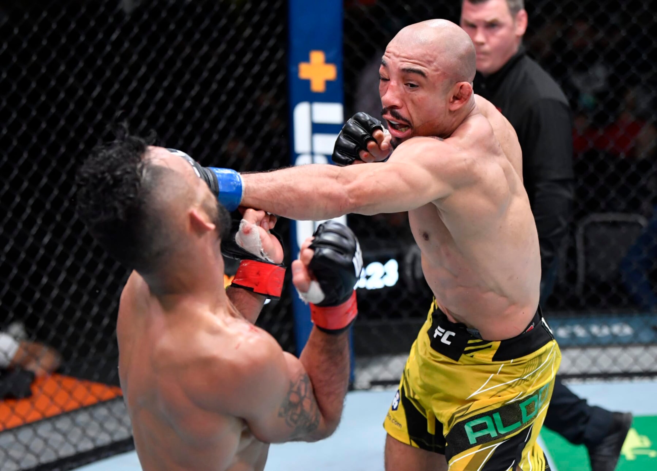 LAS VEGAS, NEVADA - DECEMBER 04: (R-L) Jose Aldo of Brazil punches Rob Font in their bantamweight fight during the UFC Fight Night event at UFC APEX on December 04, 2021 in Las Vegas, Nevada. (Photo by Jeff Bottari/Zuffa LLC)