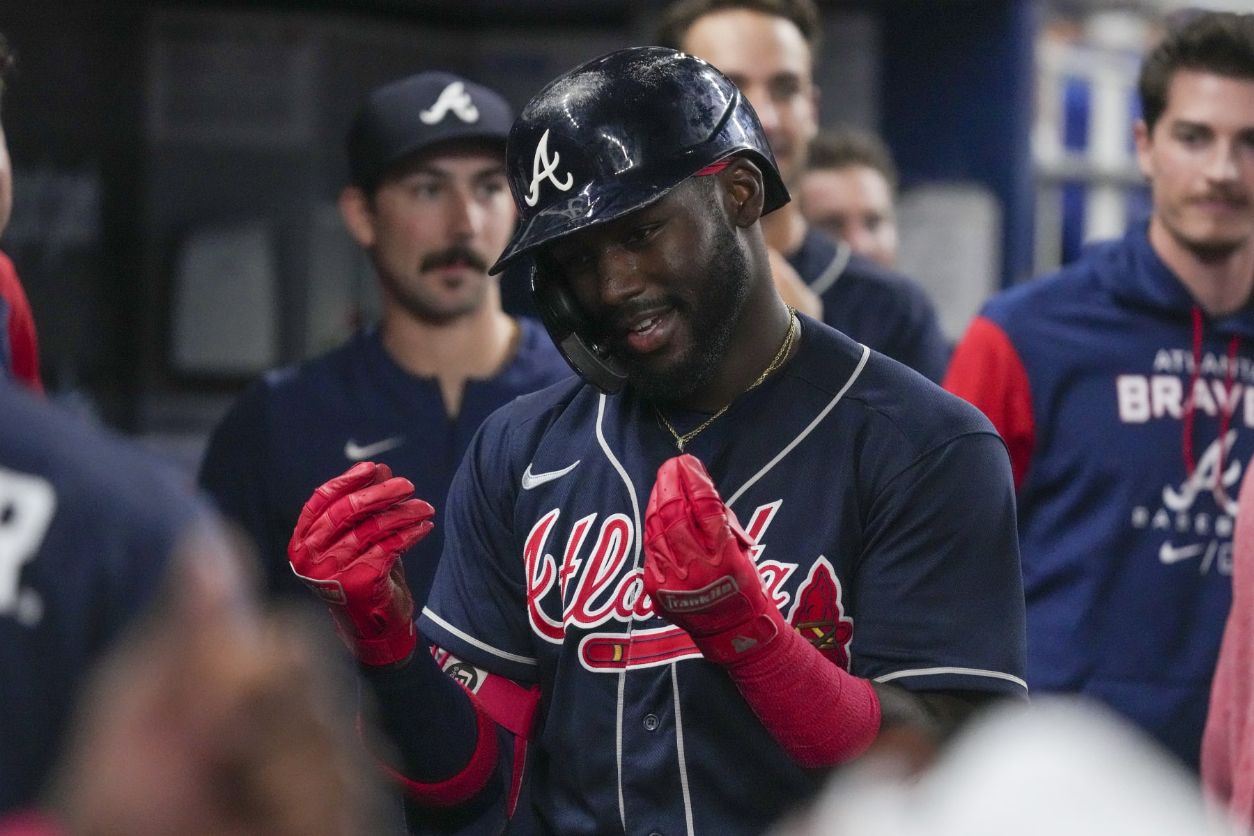 MIAMI, FLORIDA - AUGUST 14: Michael Harris II #23 of the Atlanta Braves celebrates in the dugout with teammates after hitting a home run in the ninth inning against the Miami Marlins at loanDepot park on August 14, 2022 in Miami, Florida. (Photo by Eric Espada/Getty Images) MIAMI, FLORIDA - AUGUST 14: Michael Harris II #23 of the Atlanta Braves celebrates in the dugout with teammates after hitting a home run in the ninth inning against the Miami Marlins at loanDepot park on August 14, 2022 in Miami, Florida. (Photo by Eric Espada/Getty Images)