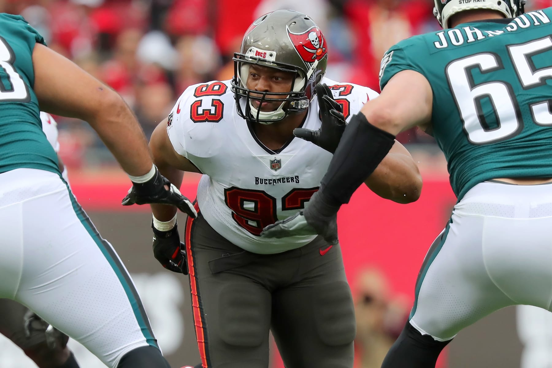 TAMPA, FL - JANUARY 16: Tampa Bay Buccaneers Defensive End Ndamukong Suh (93) rushes the passer during the NFL Wild Card game between the Philadelphia Eagles and the Tampa Bay Buccaneers on January 16, 2022 at Raymond James Stadium in Tampa, Florida. (Photo by Cliff Welch/Icon Sportswire via Getty Images)
