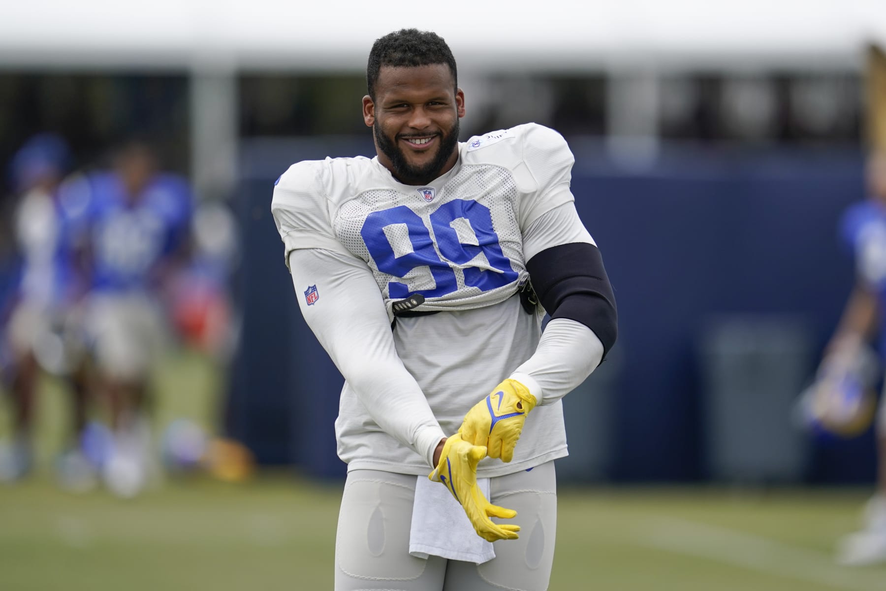 Los Angeles Rams defensive tackle Aaron Donald (99) participates in drills at the NFL football team's practice facility in Irvine, Calif. Thursday, Aug. 4, 2022. (AP Photo/Ashley Landis)