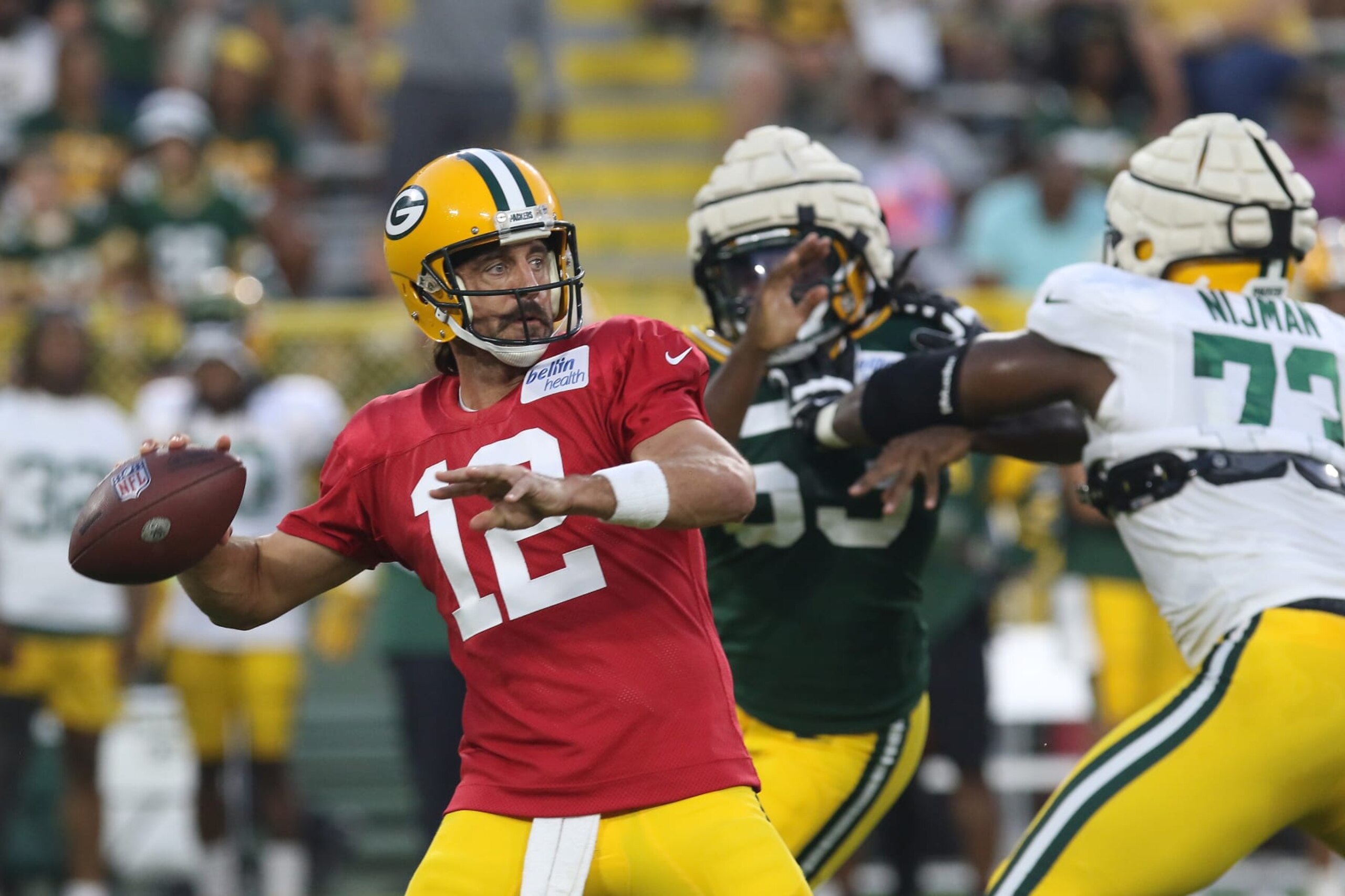 ASHWAUBENON, WI - AUGUST 05: Green Bay Packers quarterback Aaron Rodgers (12) throws the ball during Green Bay Packers Family Night at Lambeau Field, on August 5, 2022 in Green Bay, WI. (Photo by Larry Radloff/Icon Sportswire via Getty Images) ASHWAUBENON, WI - AUGUST 05: Green Bay Packers quarterback Aaron Rodgers (12) throws the ball during Green Bay Packers Family Night at Lambeau Field, on August 5, 2022 in Green Bay, WI. (Photo by Larry Radloff/Icon Sportswire via Getty Images)