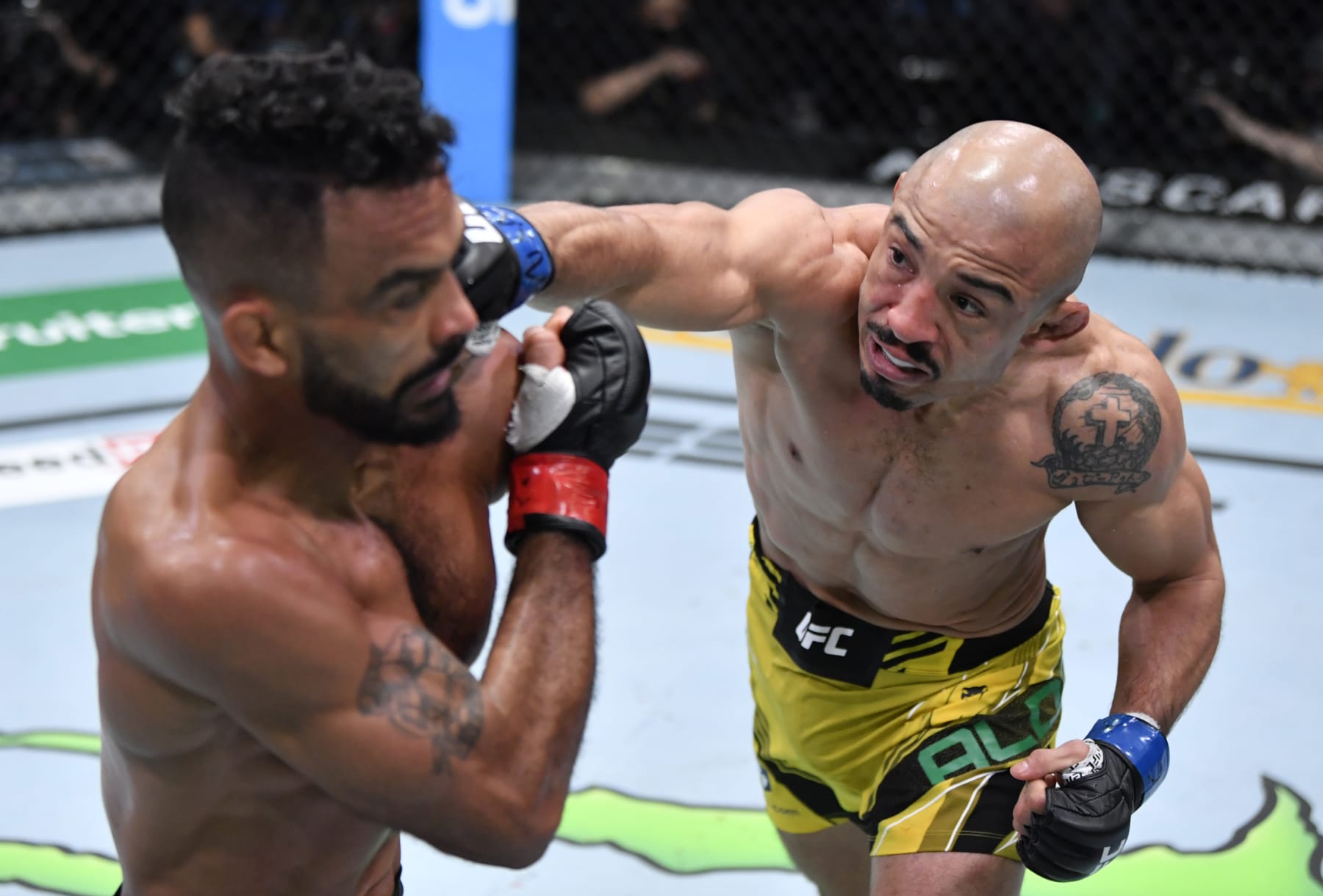 LAS VEGAS, NEVADA - DECEMBER 04: (R-L) Jose Aldo of Brazil punches Rob Font in their bantamweight fight during the UFC Fight Night event at UFC APEX on December 04, 2021 in Las Vegas, Nevada. (Photo by Jeff Bottari/Zuffa LLC)