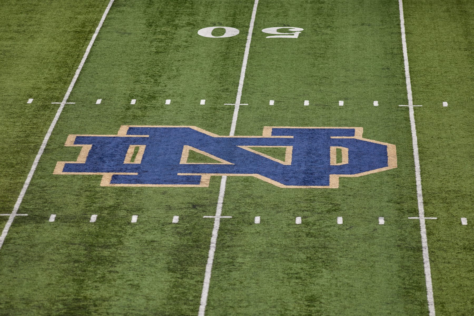 SOUTH BEND, IN - SEPTEMBER 11: A detail view of the Notre Dame Fighting Irish logo is seen at the center of the field during a game between the Notre Dame Fighting Irish and the Toledo Rockets on September 11, 2021 at Notre Dame Stadium, in South Bend, IN. (Photo by Robin Alam/Icon Sportswire via Getty Images)